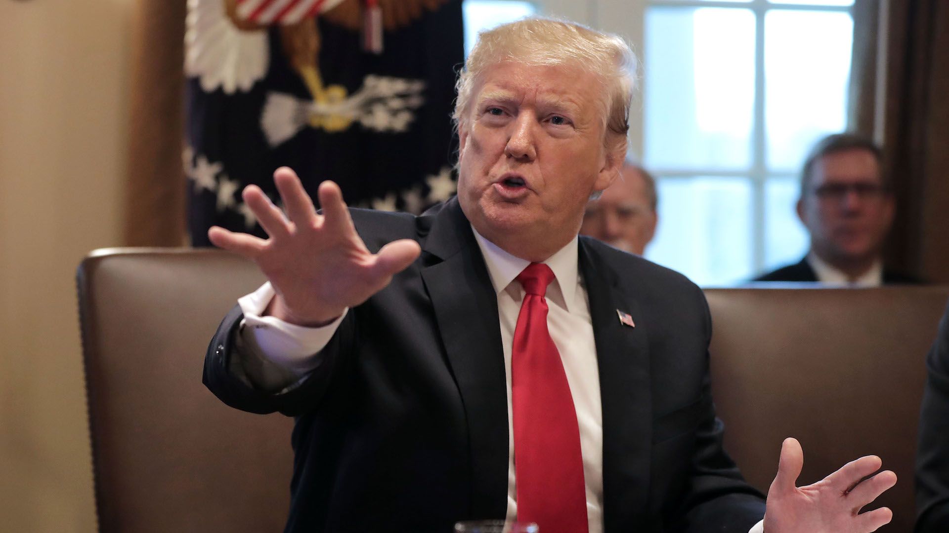 U.S. President Donald Trump talks to journalists during a meeting of his Cabinet on Jan. 2, 2019.