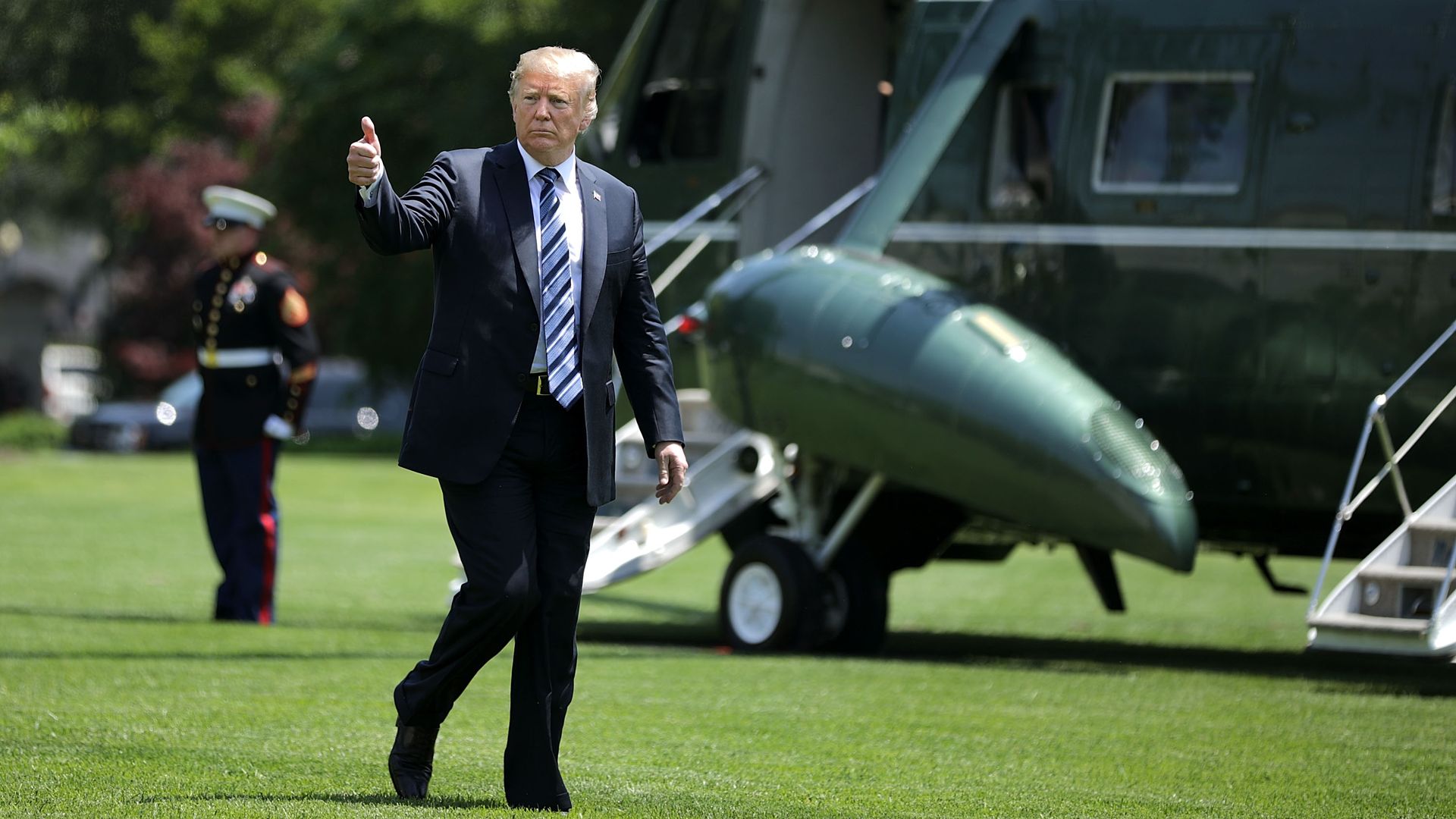 Donald Trump giving a thumbs-up.