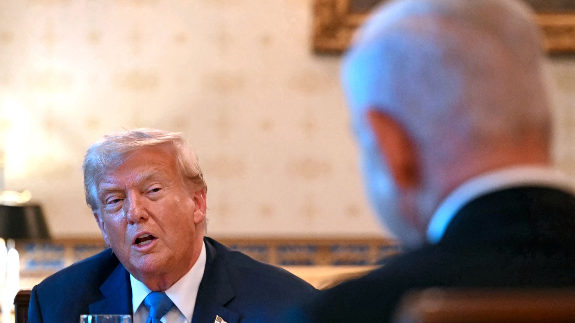 President Donald Trump meets with Israeli Prime Minister Benjamin Netanyahu (R) at the Blue Room of the White House in Washington, DC, on July 7, 2025. 