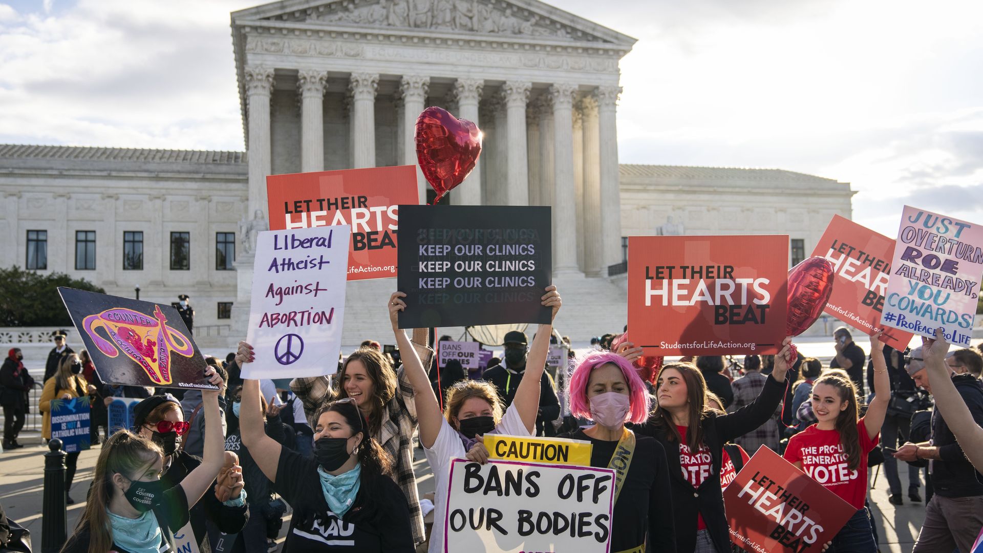 Abortion and anti-abortion rights demonstrators rally outside the U.S. Supreme Court. 