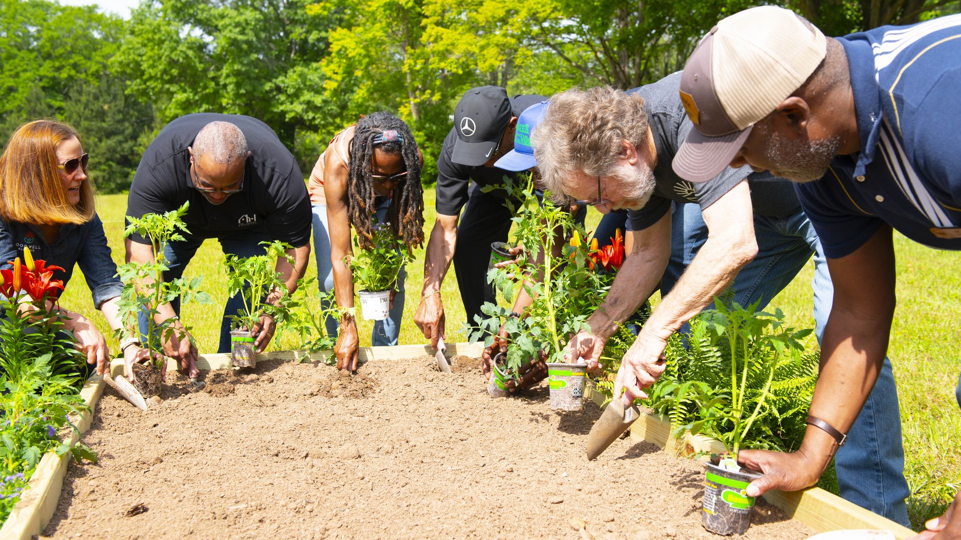 Volunteers participate in a first planting ceremony at the Leila Valley Community Farm in southeast Atlanta.