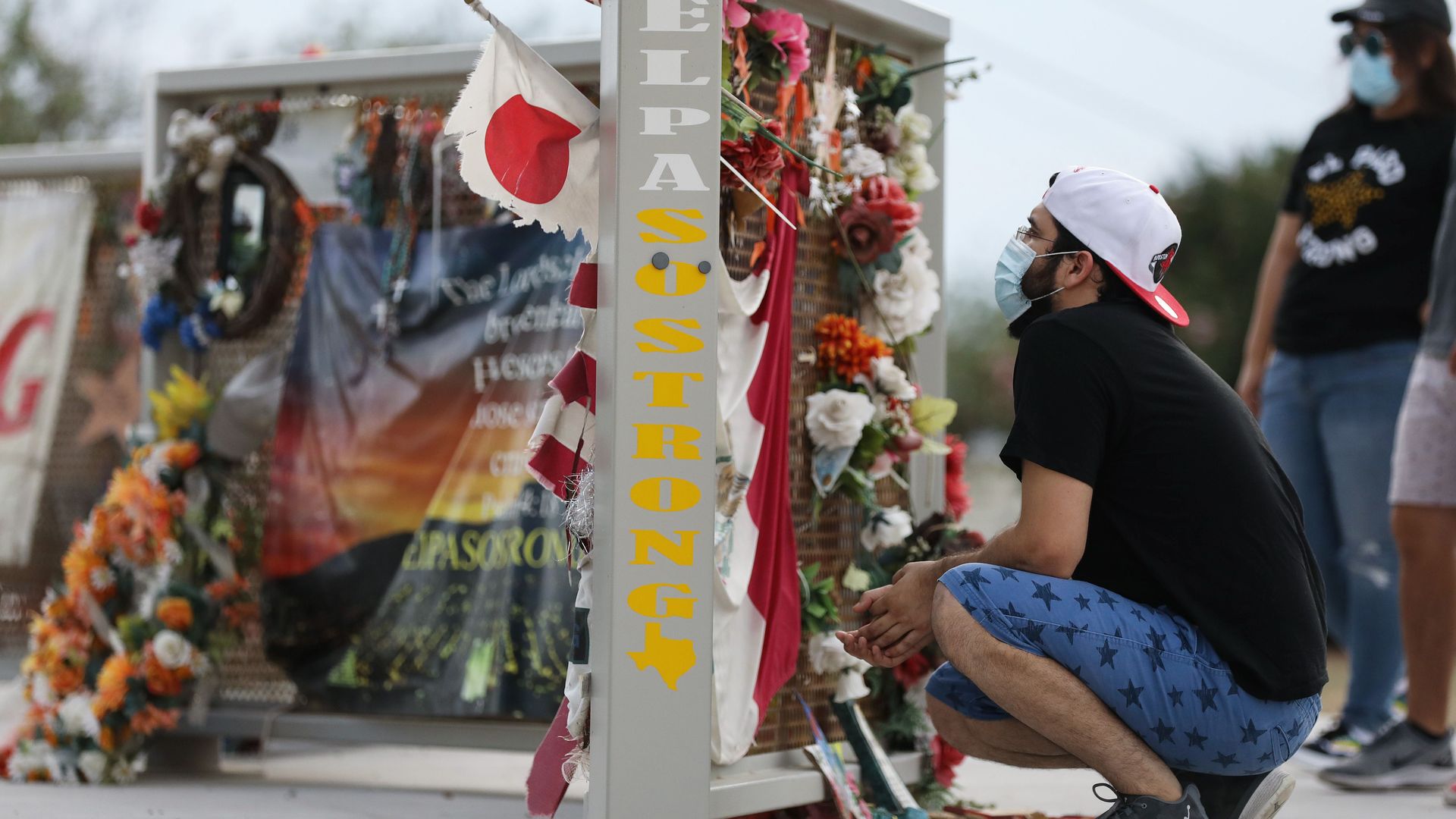 People view a temporary memorial in Ponder Park honoring victims of the Walmart shooting which left 23 people dead in a racist attack targeting Latinos on August 2, 2020 in El Paso, Texas.