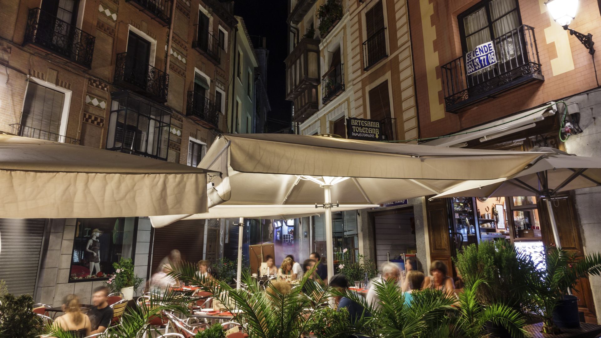 People eat outside, under tents