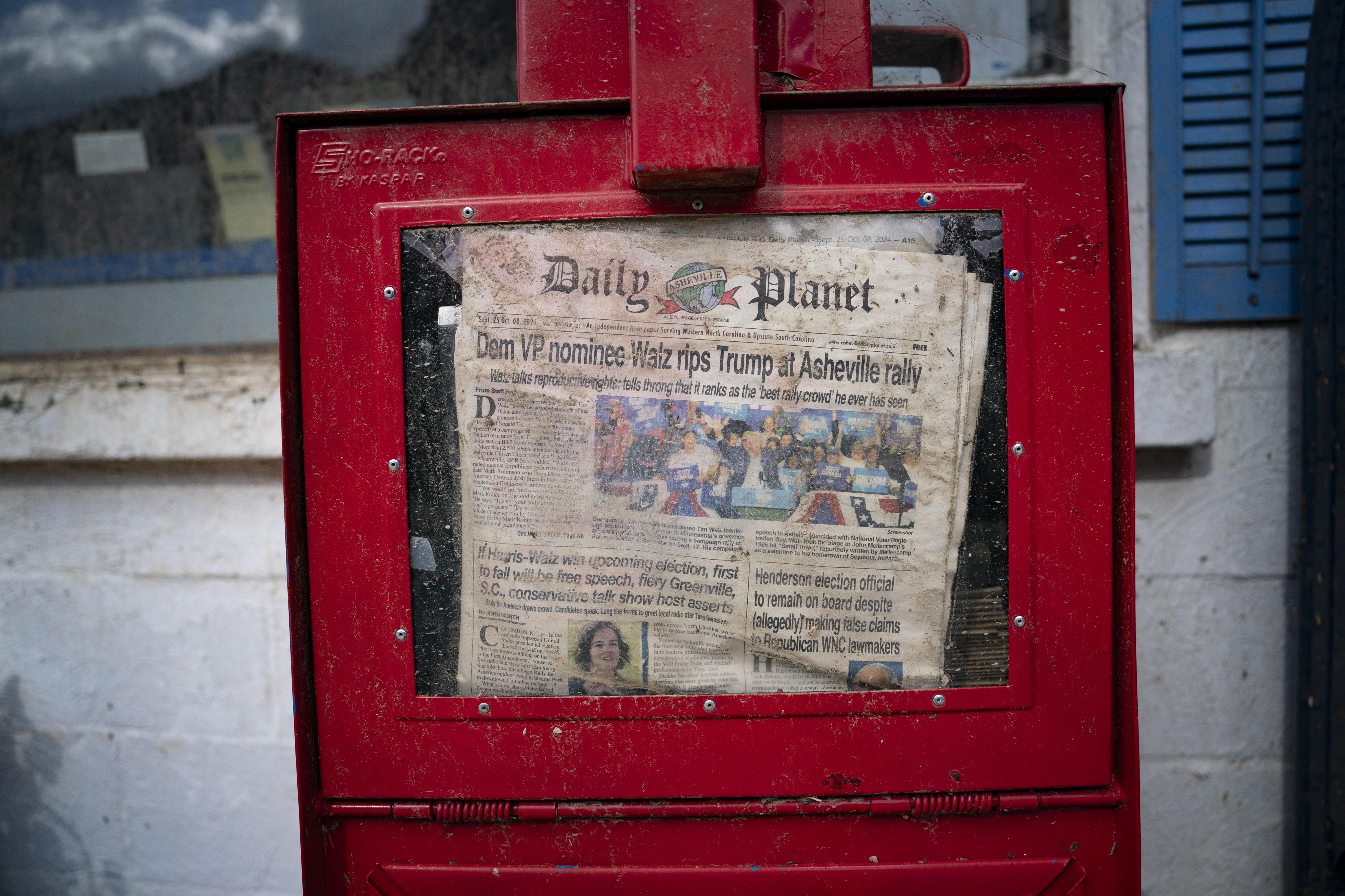 dirty newspaper box with election headline