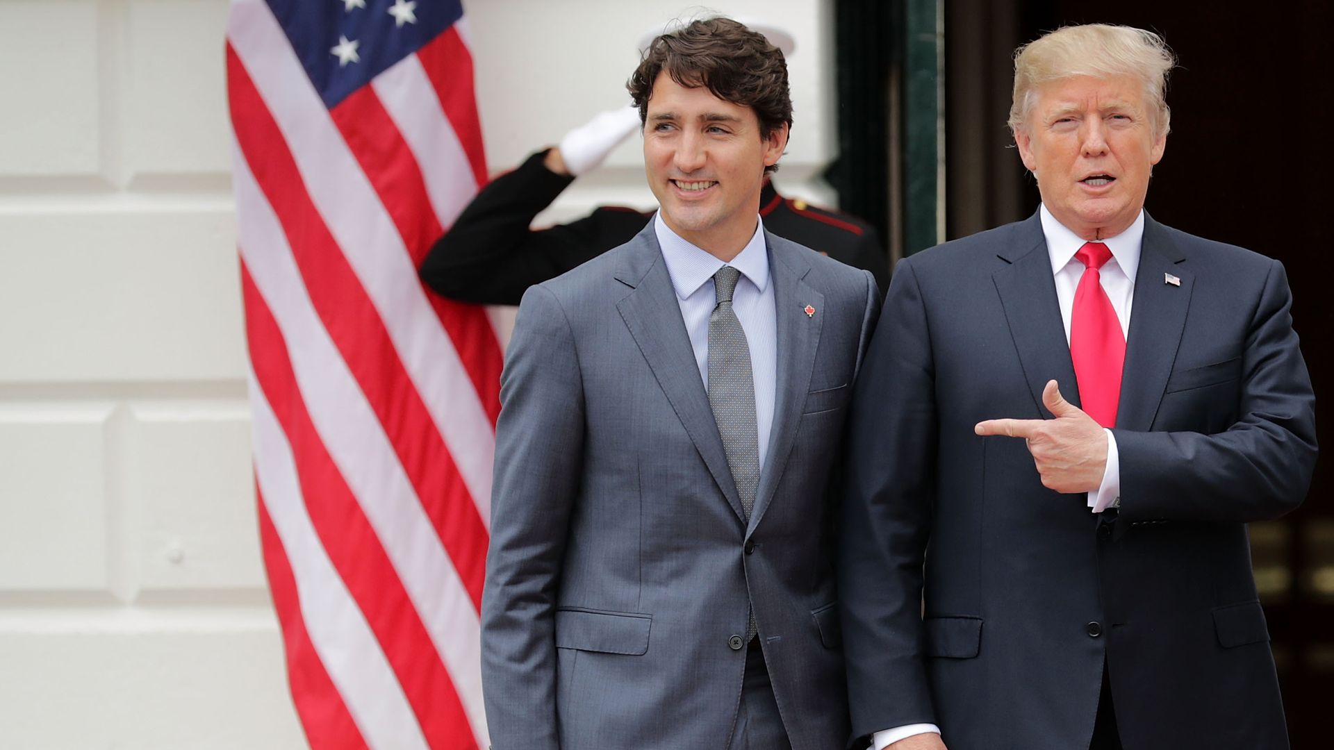 Donald Trump pointing to Justin Trudeau 