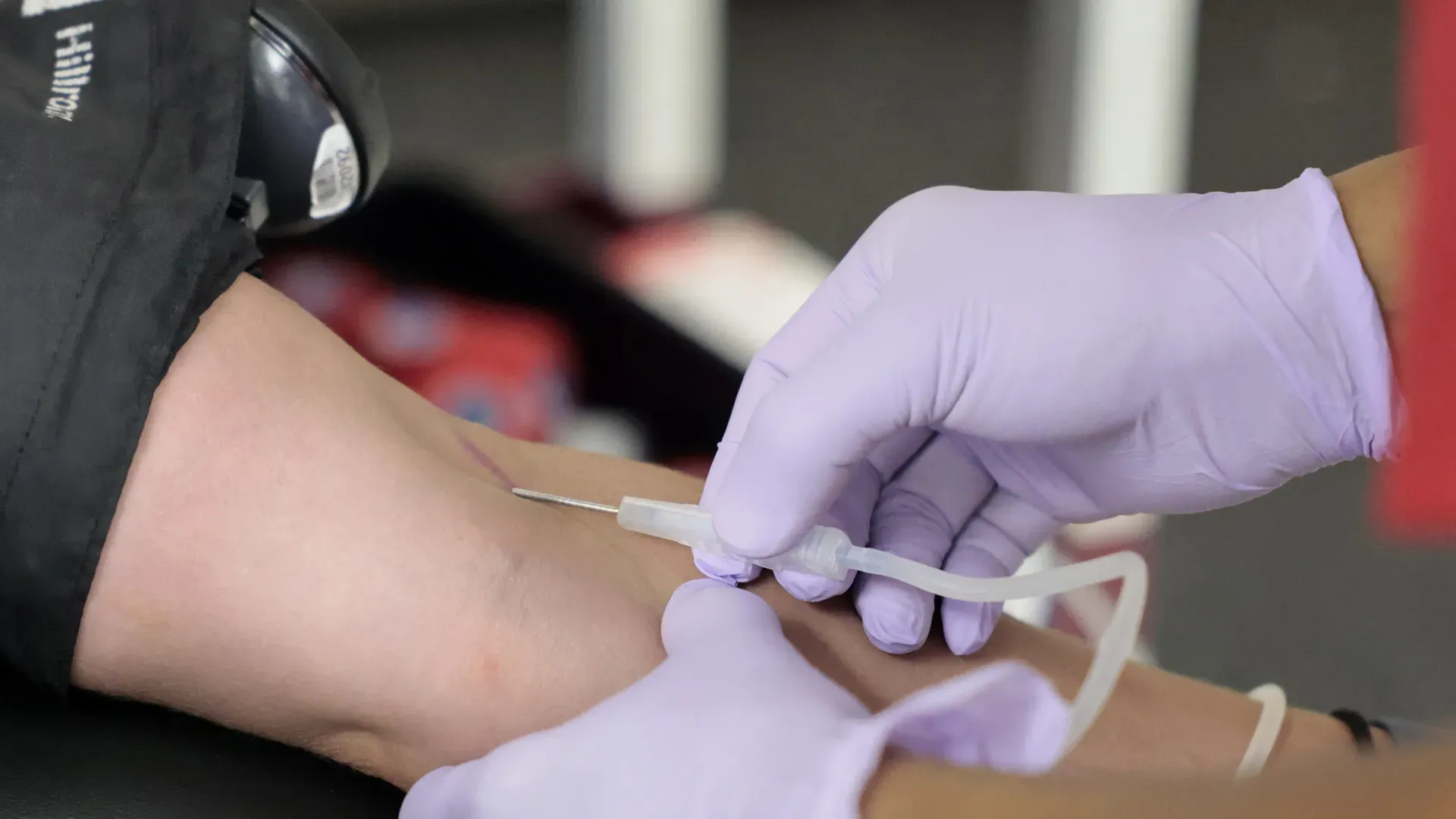 A woman donates blood at an American Red Cross Blood Donation Center in Boston on July 14, 2026. Photo: Pat Greenhouse/The Boston Globe via Getty Images