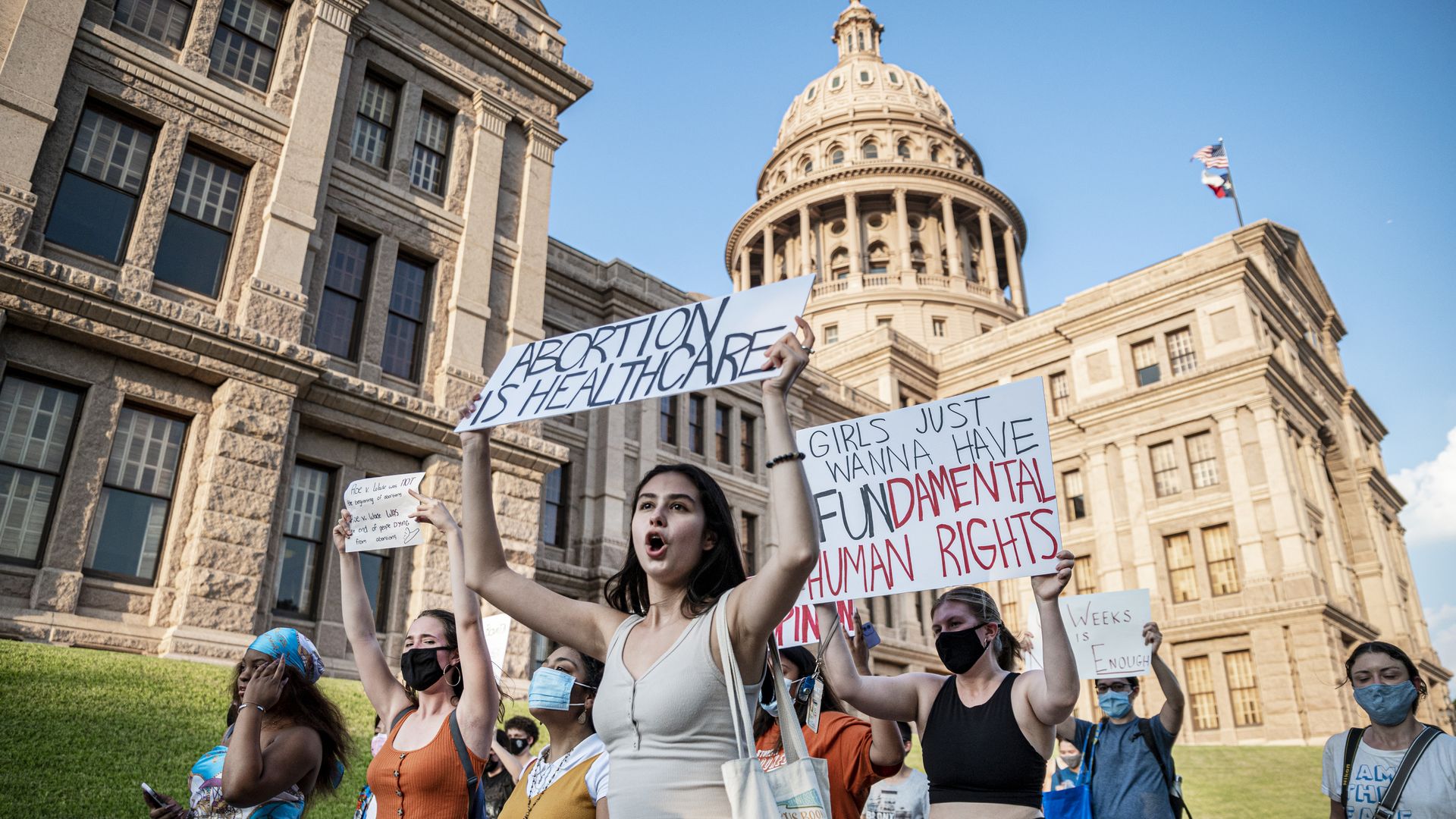 Pro-choice protesters march outside the Texas State Capitol on Wednesday, Sept. 1