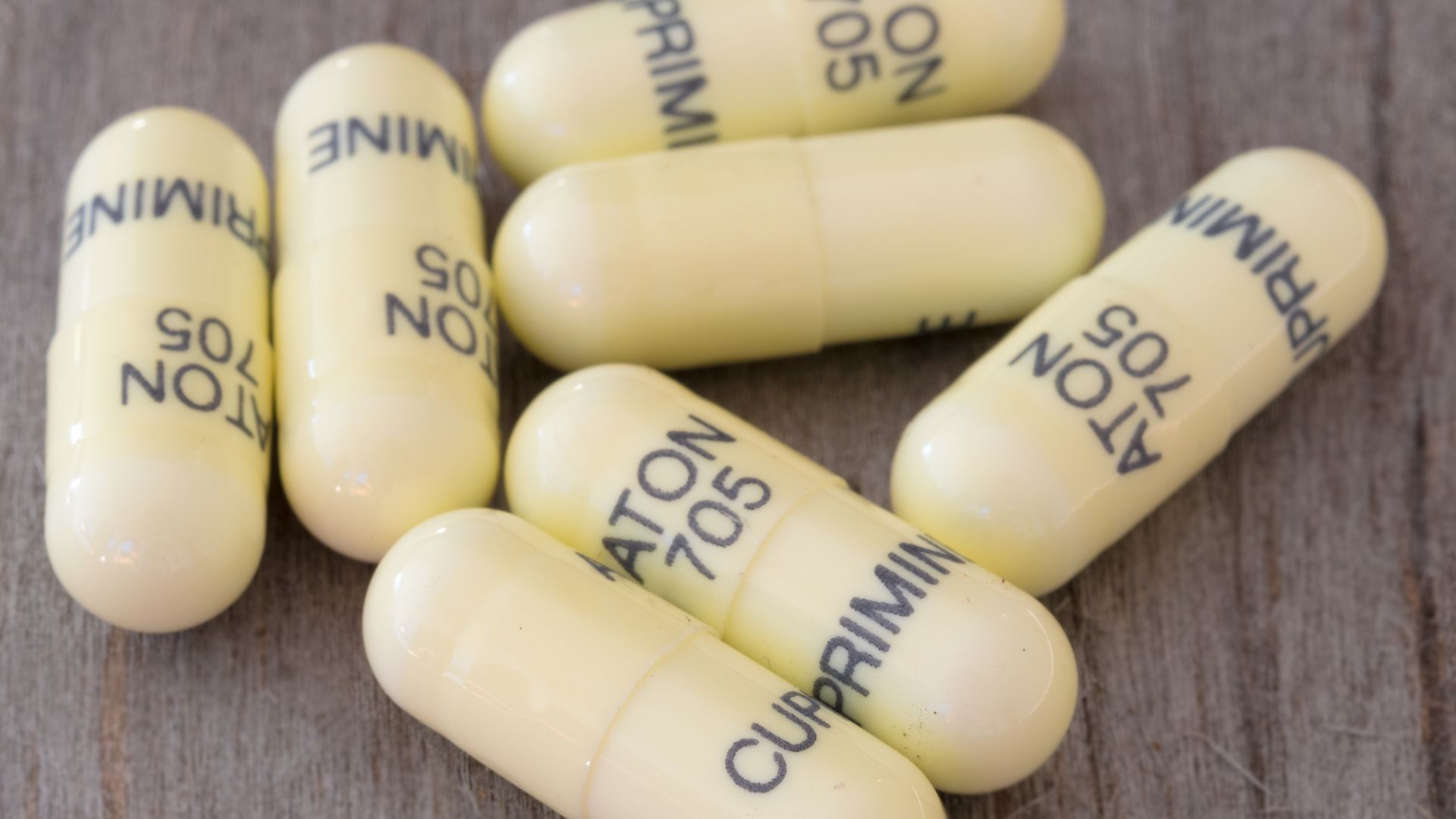 Cuprimine drug capsules sit on a table.
