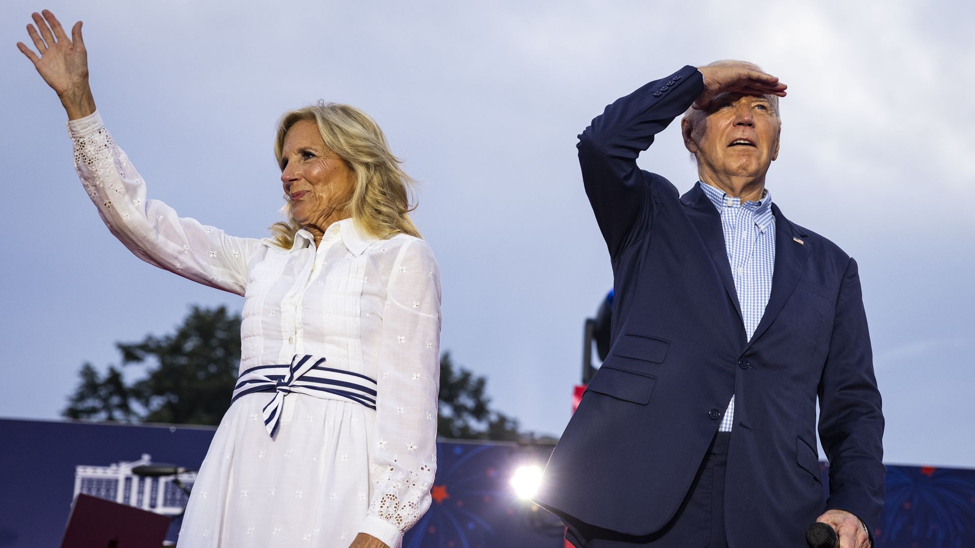 First Lady Jill Biden and President Joe Biden walk on stage during a 4th of July event on the South Lawn of the White House on July 4, 2024 in Washington, DC.