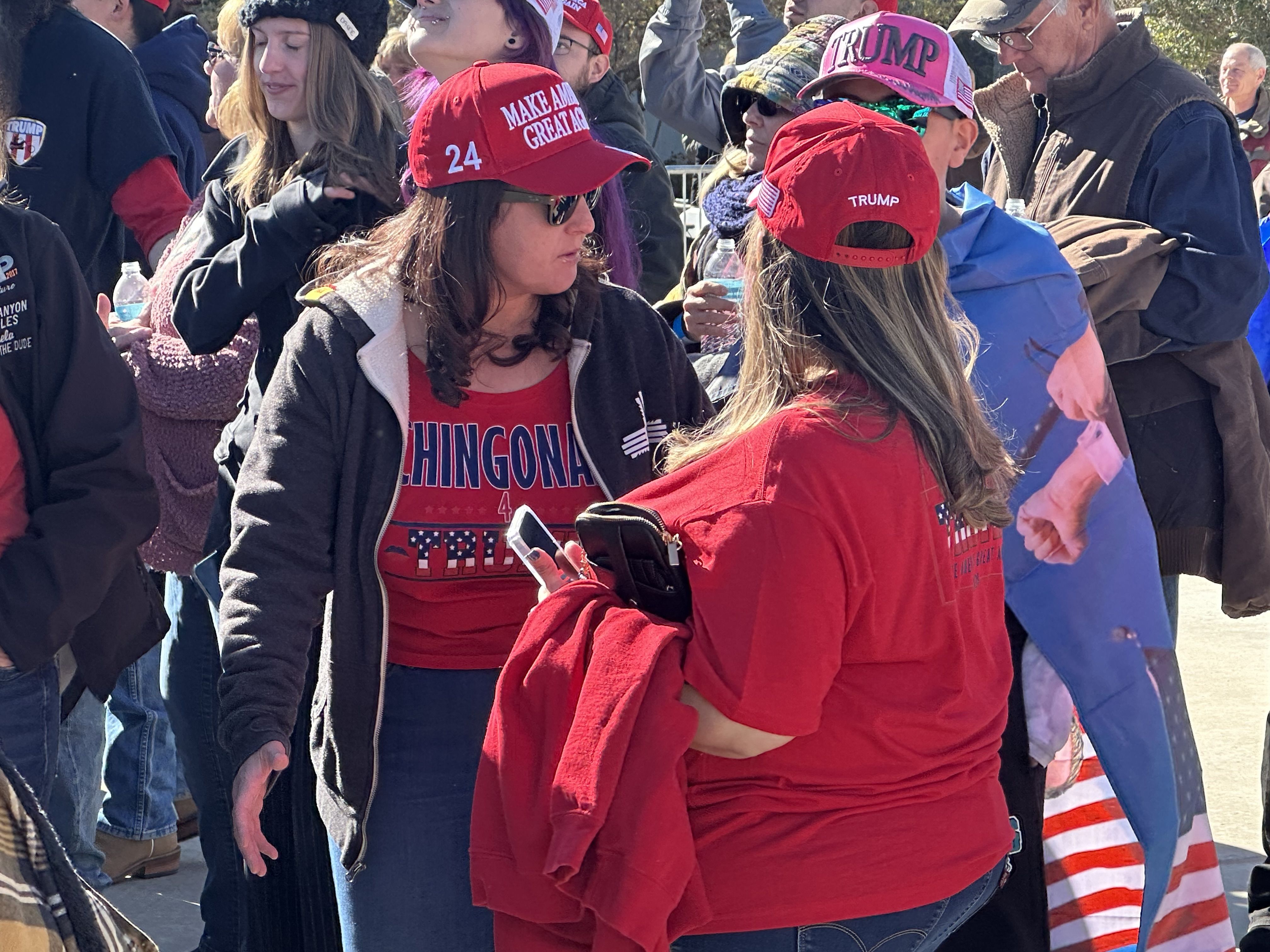 A group of Latina Trump supporters wait for Trump to speak in Albuquerque on Thursday, Oct. 31, 2024.