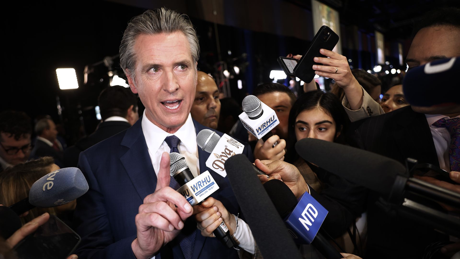 California Governor Gavin Newsom talks to journalists in the media center at the Pennsylvania Convention Center before the first presidential debate between Republican presidential nominee, former President Donald Trump and Democratic presidential nominee, U.S. Vice President Kamala Harris.