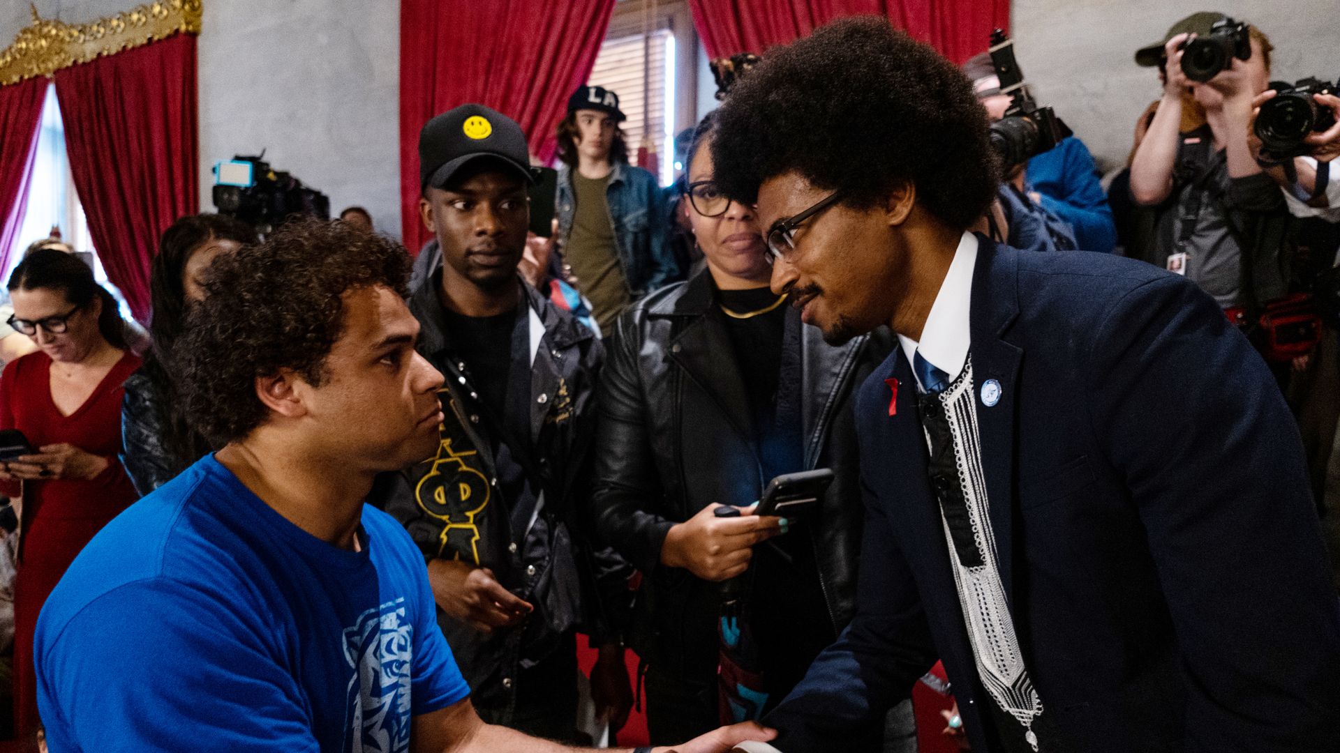 Justin Pearson shakes hands with a supporter