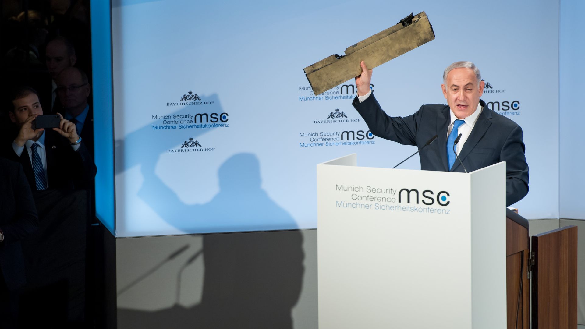 Israeli Prime Minister Benjamin Netanyahu holds up what he claims is a piece of an Iranian drone.