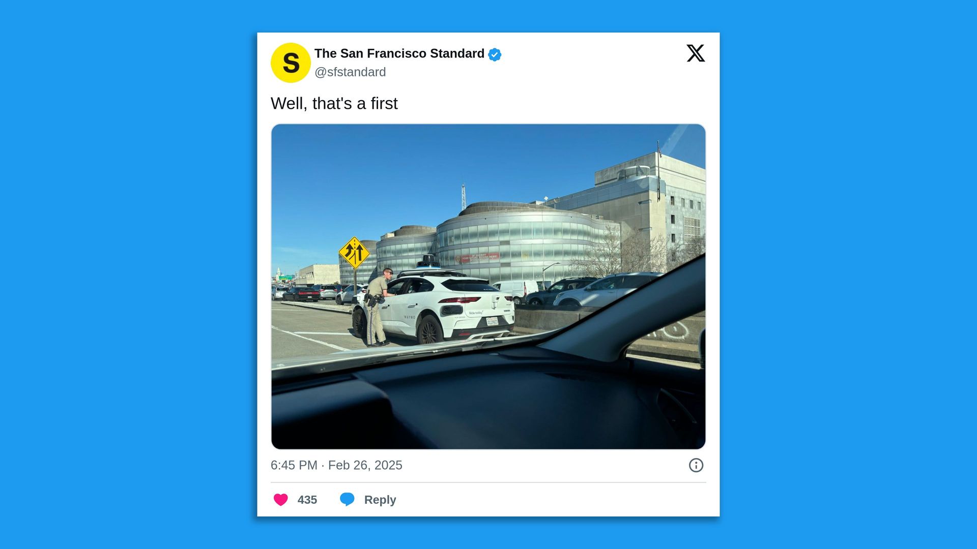 Screenshot of a tweet from The San Francisco Standard with a picture of a cop pulling over a Waymo