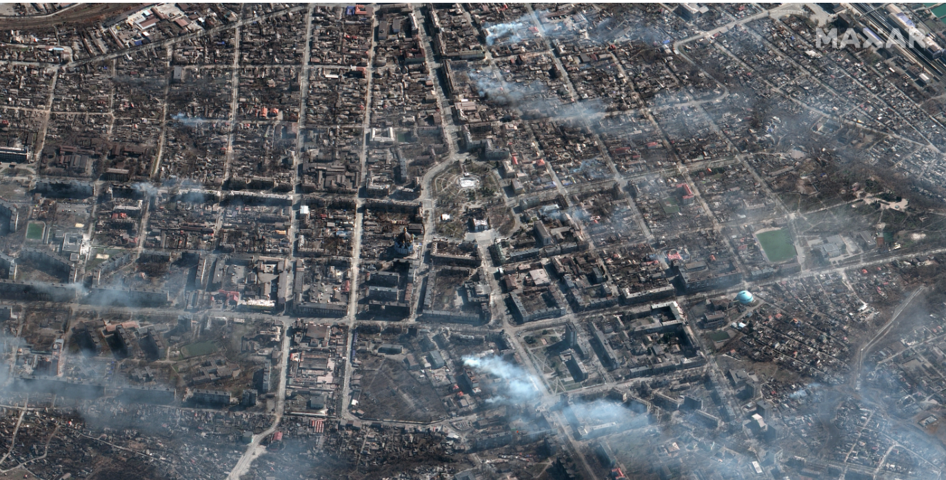 An overview of Mariupol theater and the surrounding areas' burning buildings from ongoing artillery shelling in March.
