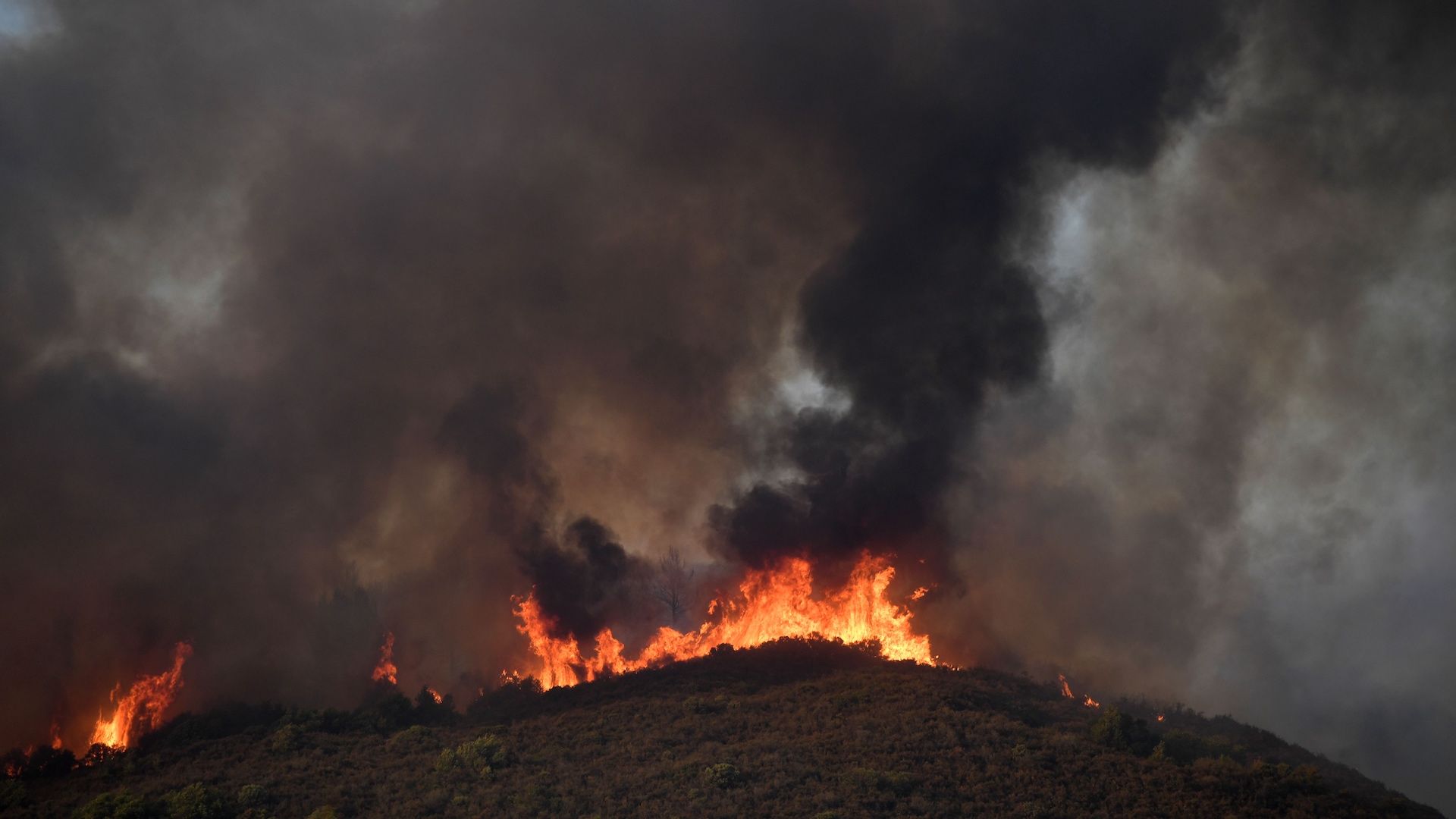 The Ranch fire moves down the ridge as it spreads towards the town of Upper Lake, California on August 1, 2018.