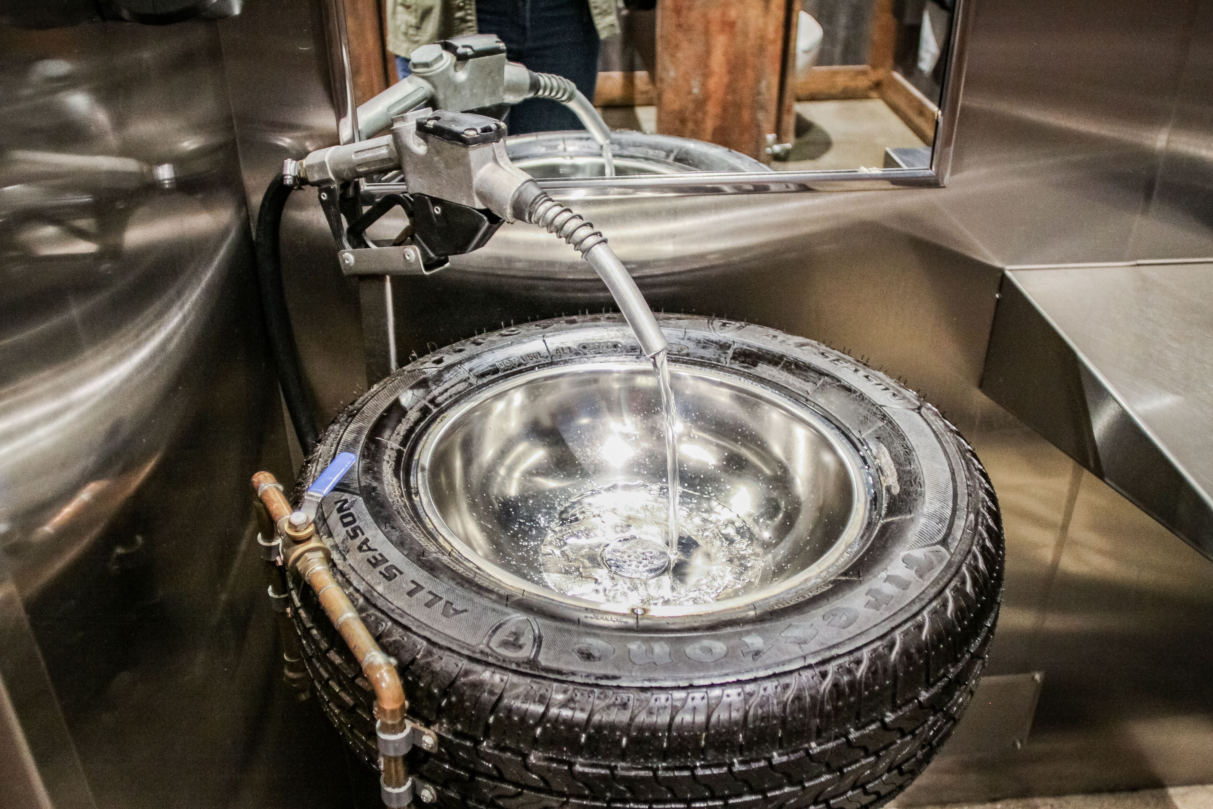 an old gas handle flowing into a tire sink bowl 