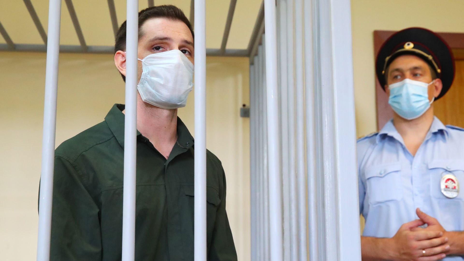 Trevor Reed stands imprisoned behind bars