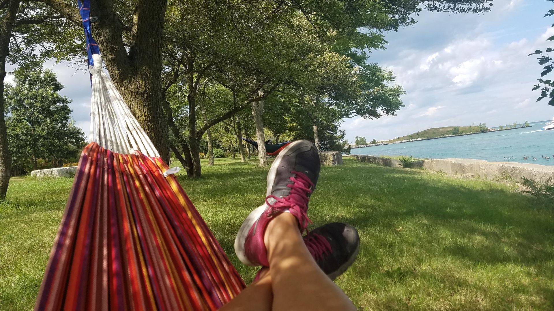 Photo of a woman's feet on a hammock.