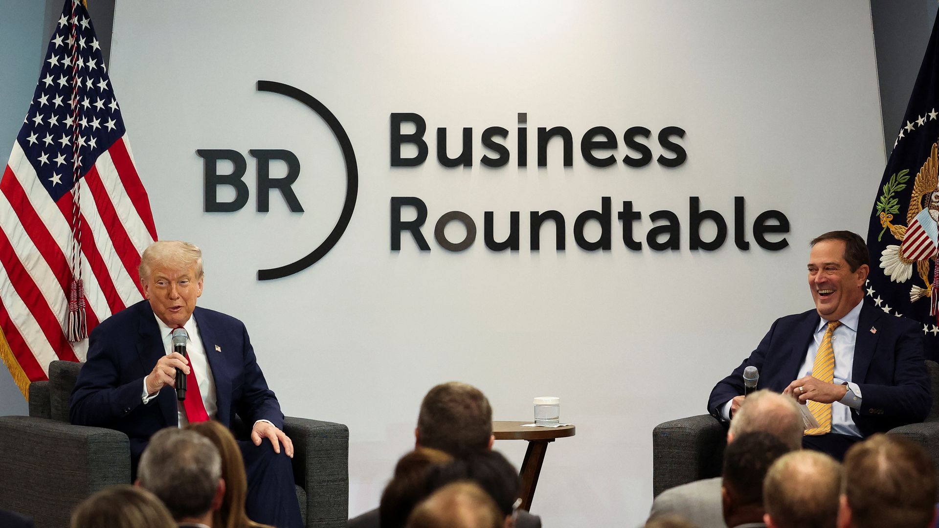 President Trump talks with Chuck Robbins, Cisco CEO and Business Roundtable chair, at The Wharf in D.C. on Tuesday. Photo Kevin Lamarque/Reuters