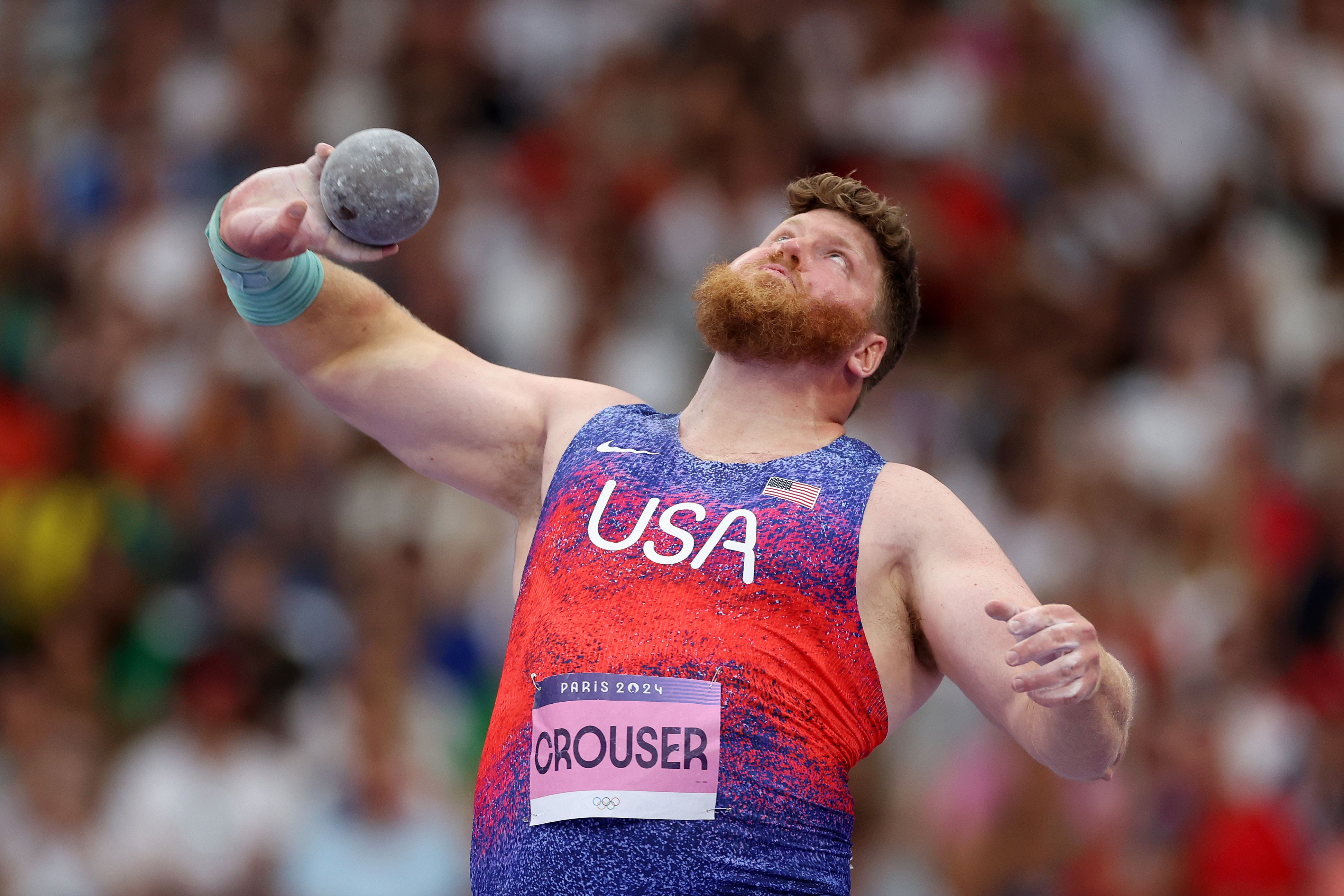 Crouser in the middle of a throw