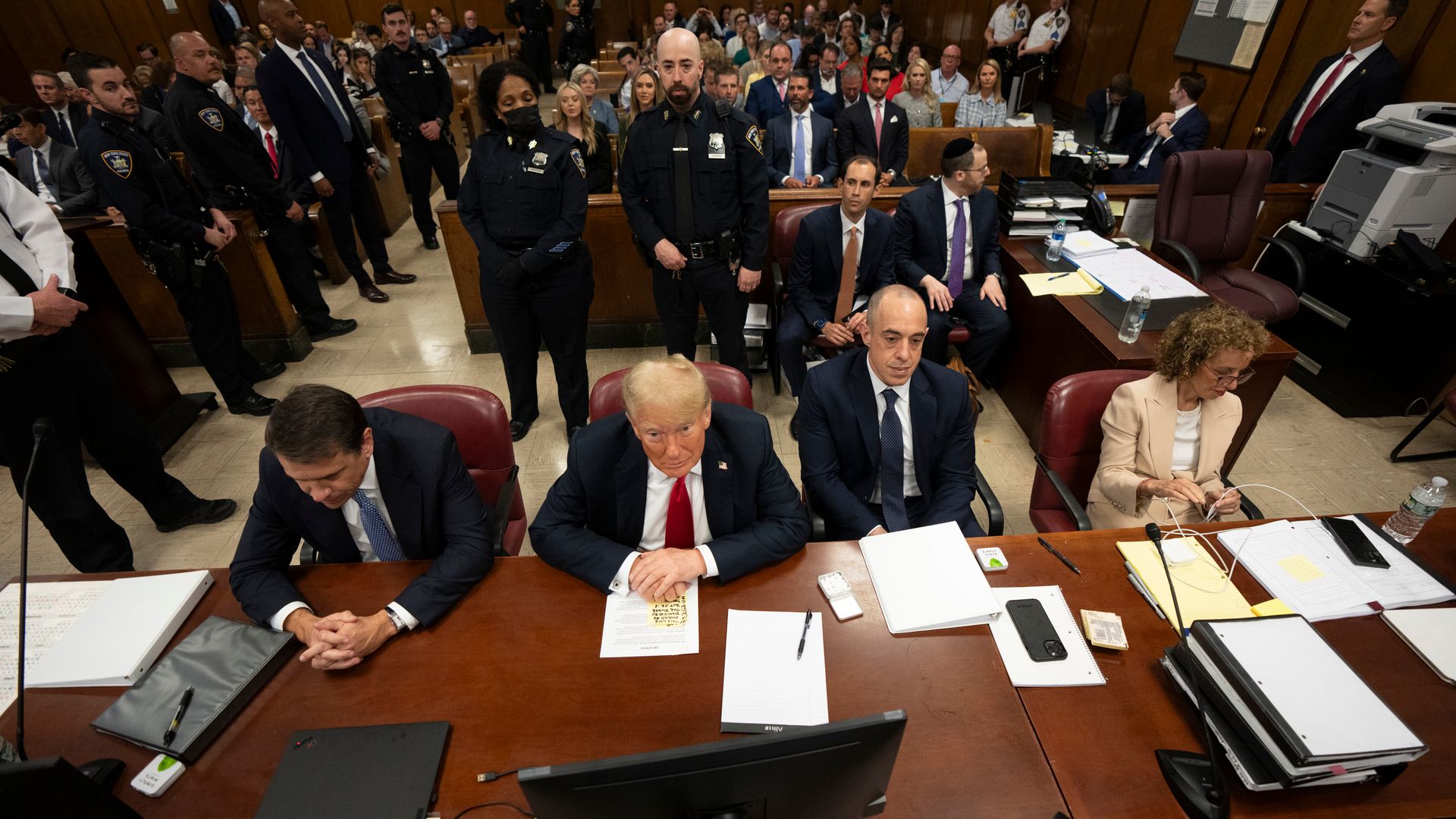 Donald Trump, and his attorneys sit in a Manhattan criminal court in New York on May 28, 2024.