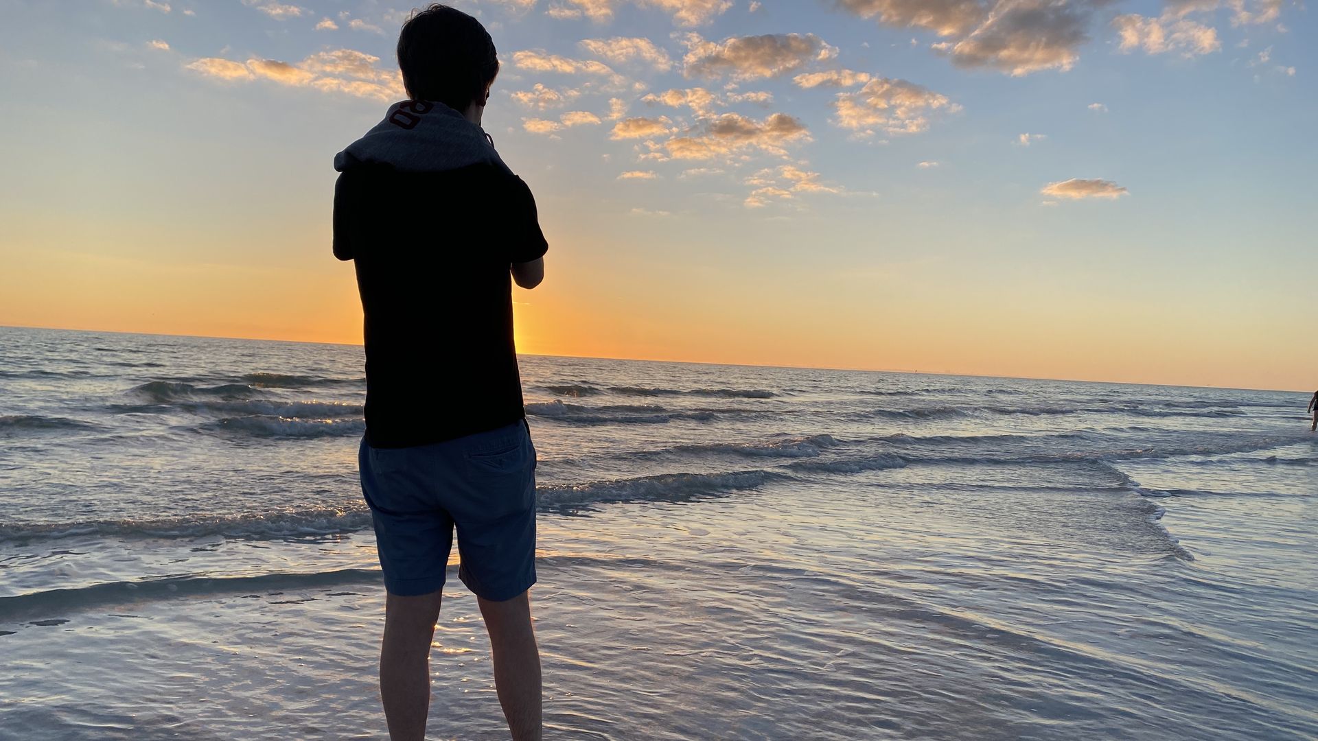 Silhouette of Shane taking in the sunset at Lido Beach