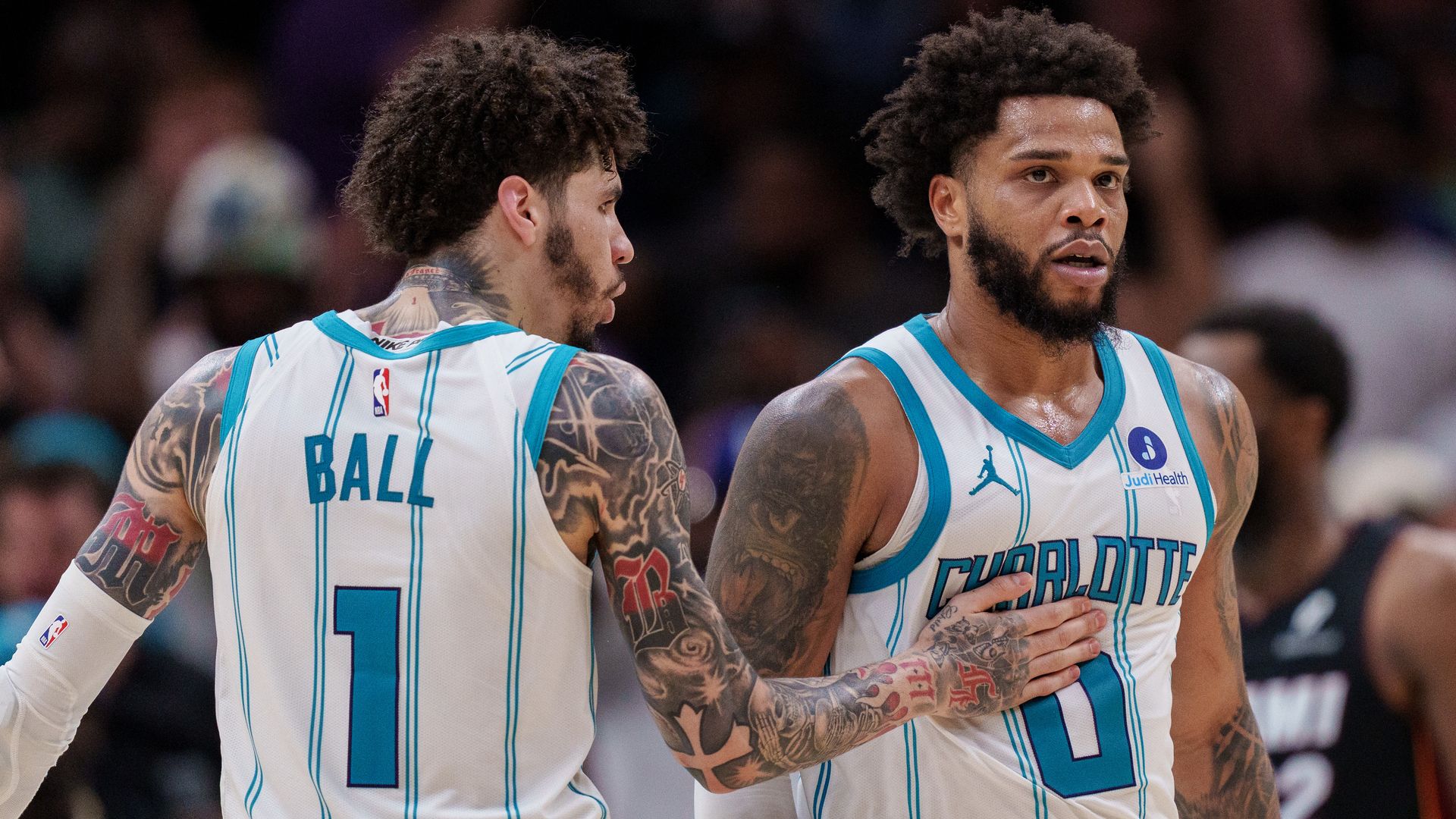 LaMelo Ball and Miles Bridges on the court. 