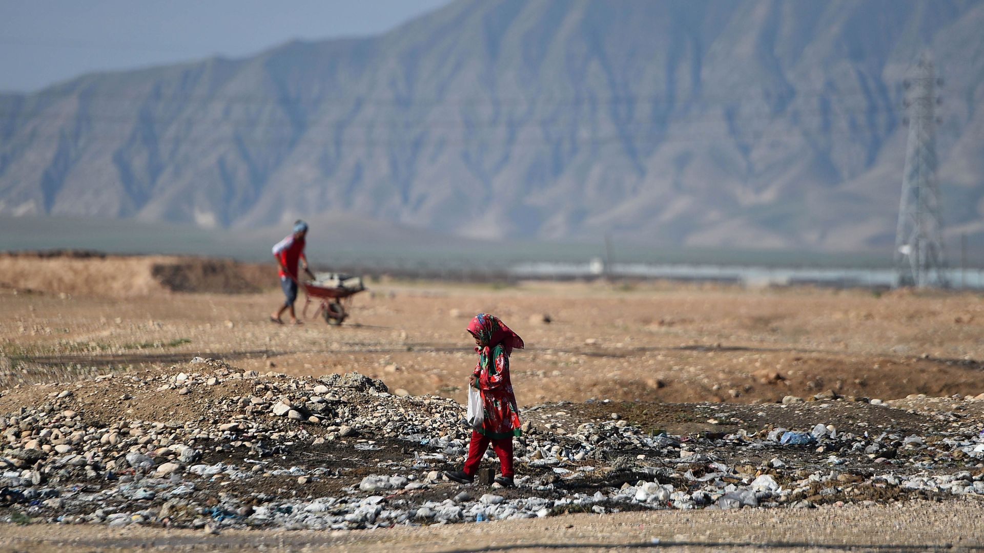 An Afghan girl searches for recylables. Photo: FARSHAD USYAN / AFP