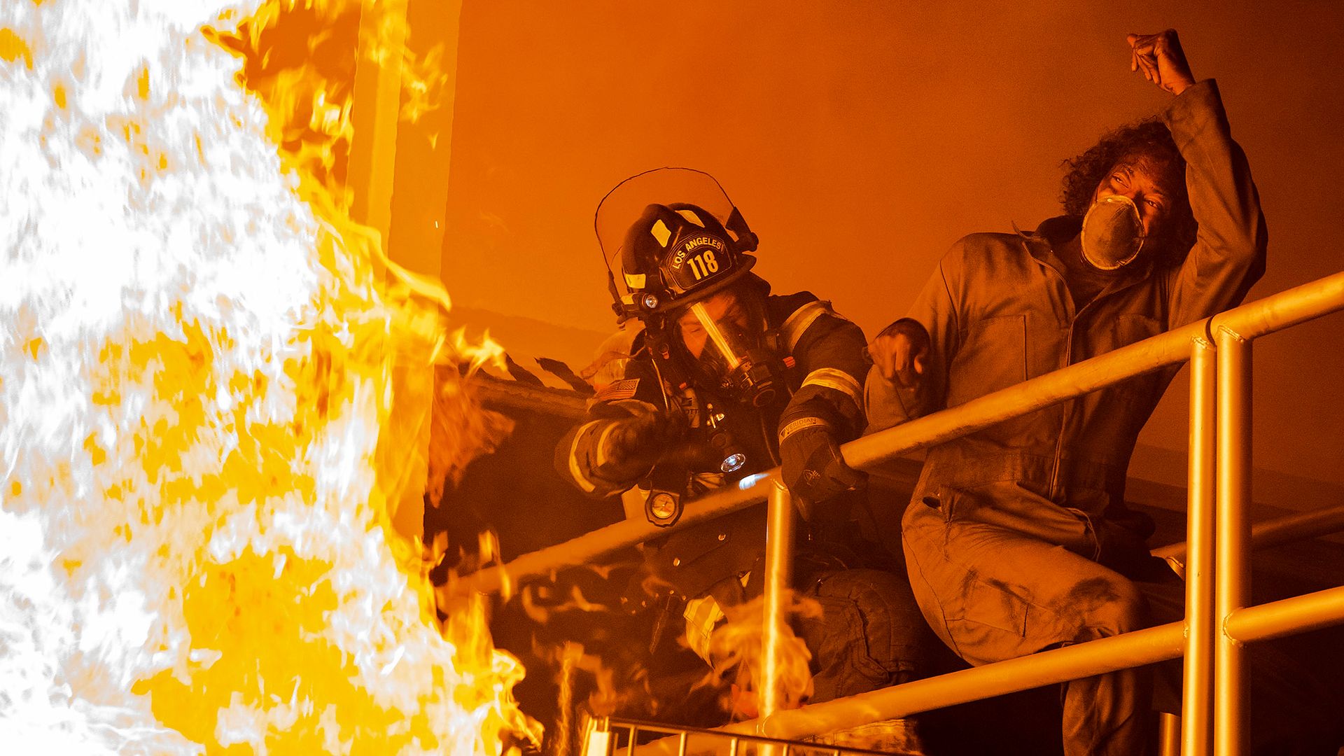 An episode of 9-1-1 showing a fire blazing.