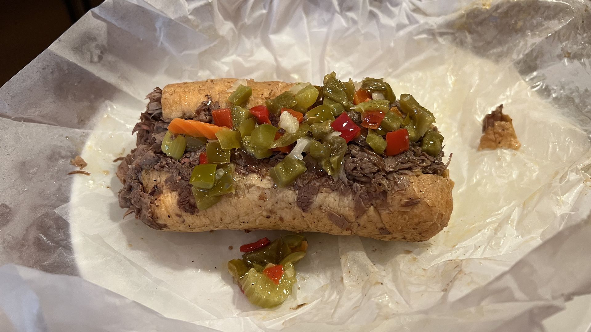 Phot of a sandwich on wax paper. 