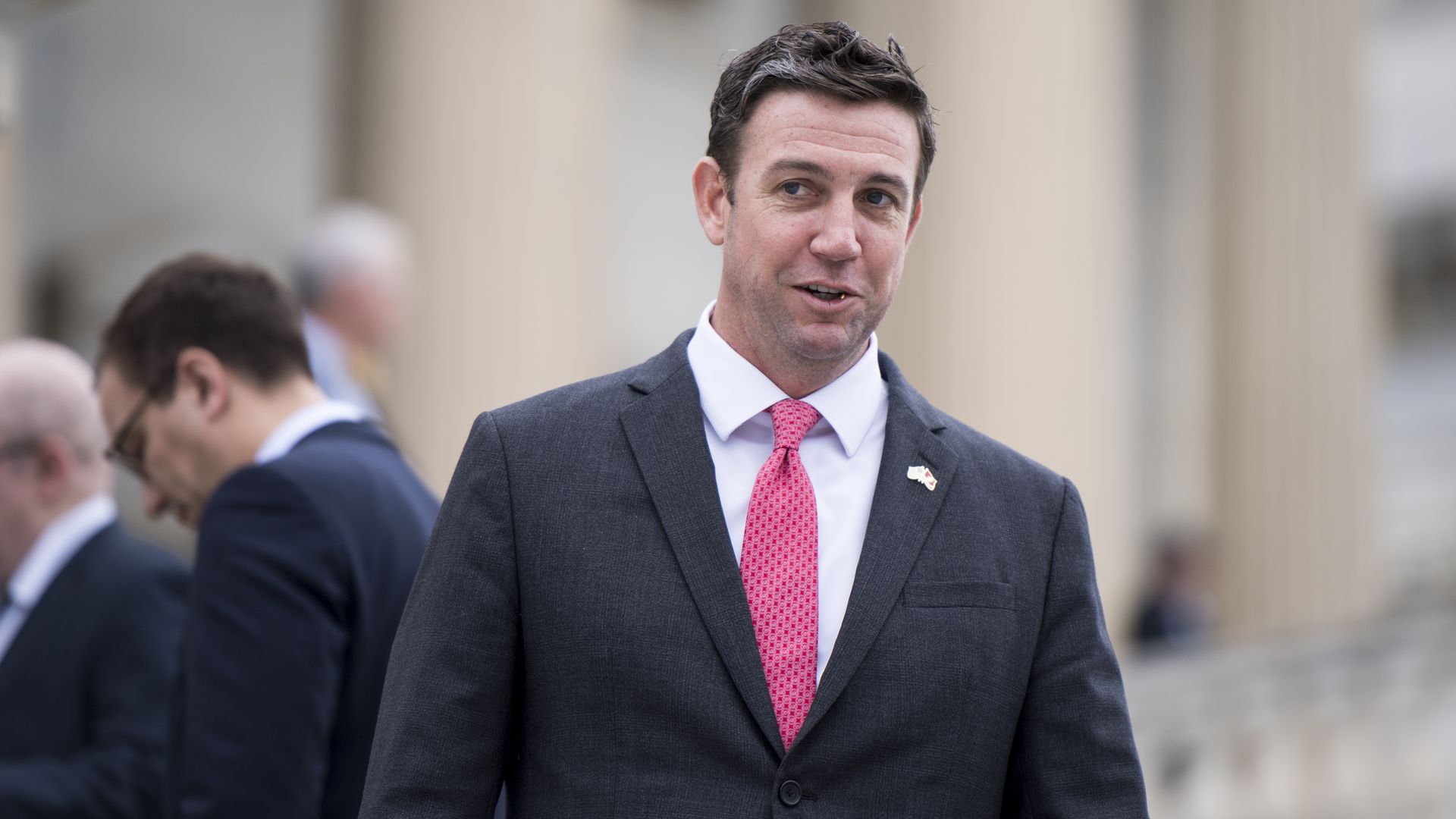 Duncan Hunter in a suit walking.