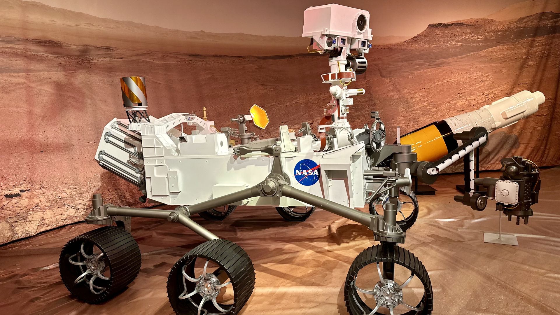 A photo of a replica of the perseverance rover