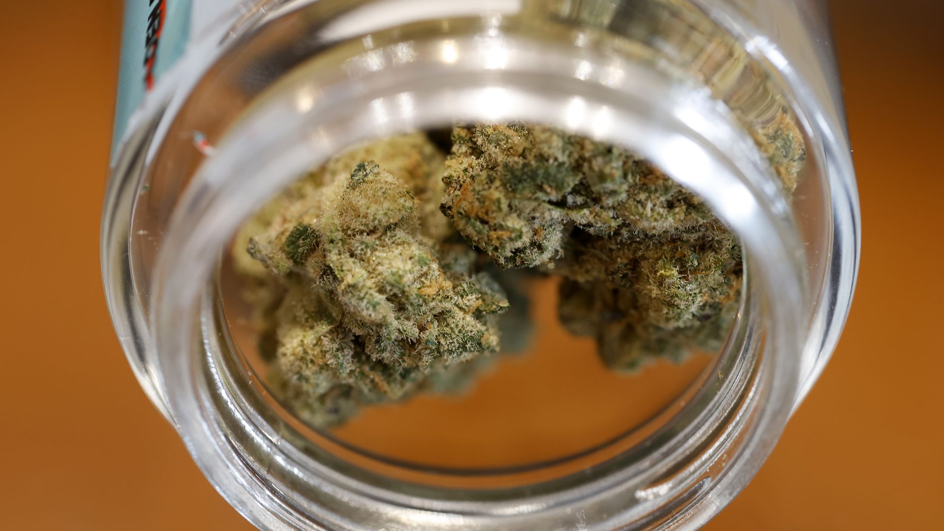 A close-up of a glass jar filled with marijuana buds on display at California Street Cannabis Company in San Francisco.