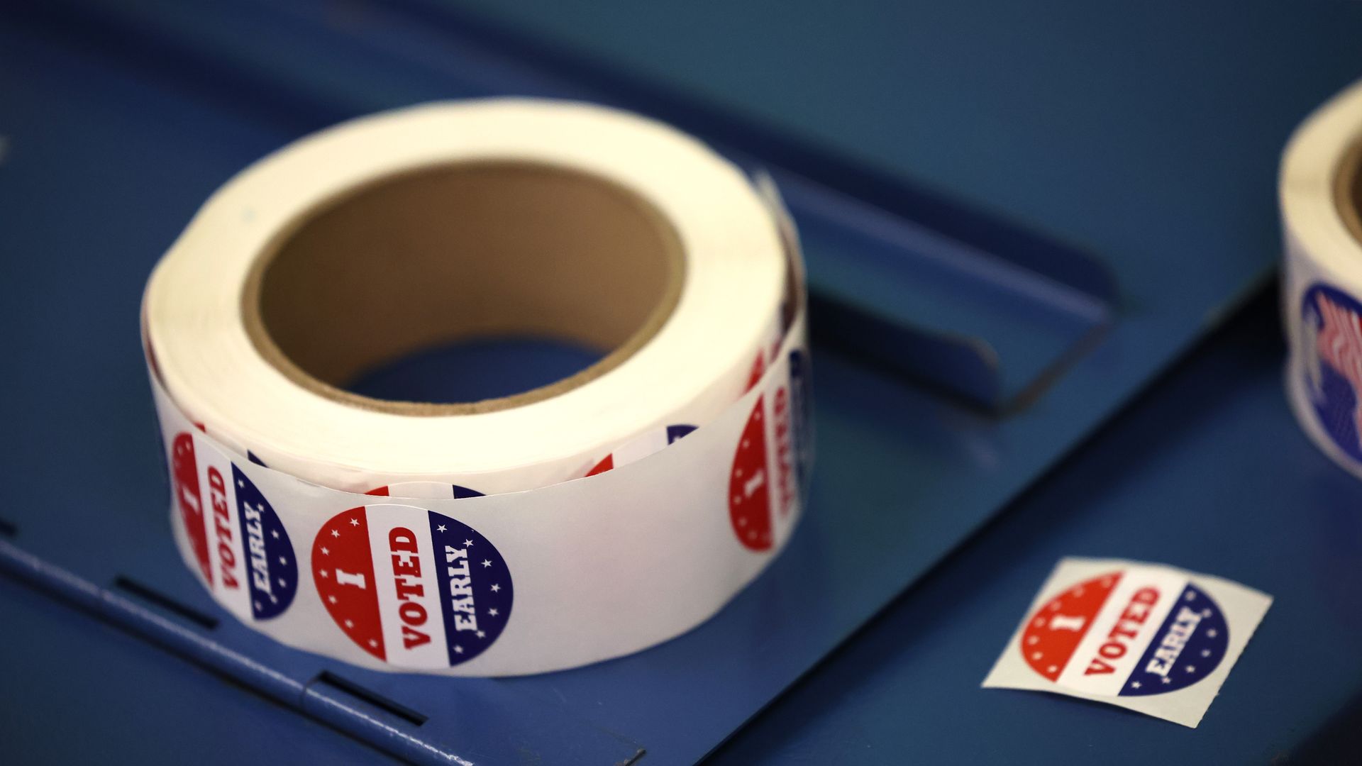 A roll of "I voted early" stickers on a table