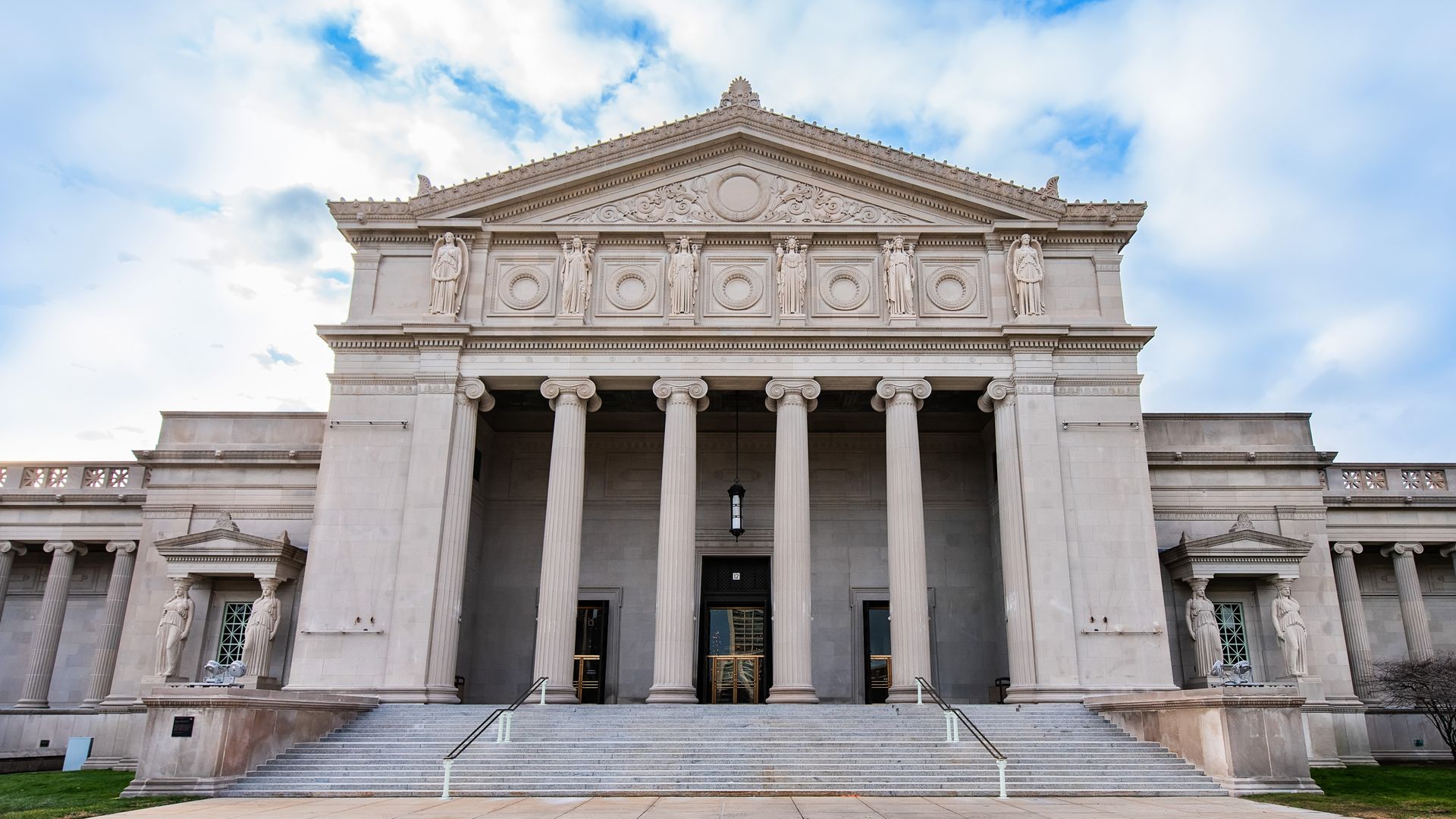 The front of the Museum of Science and Industry with its steps and columns.