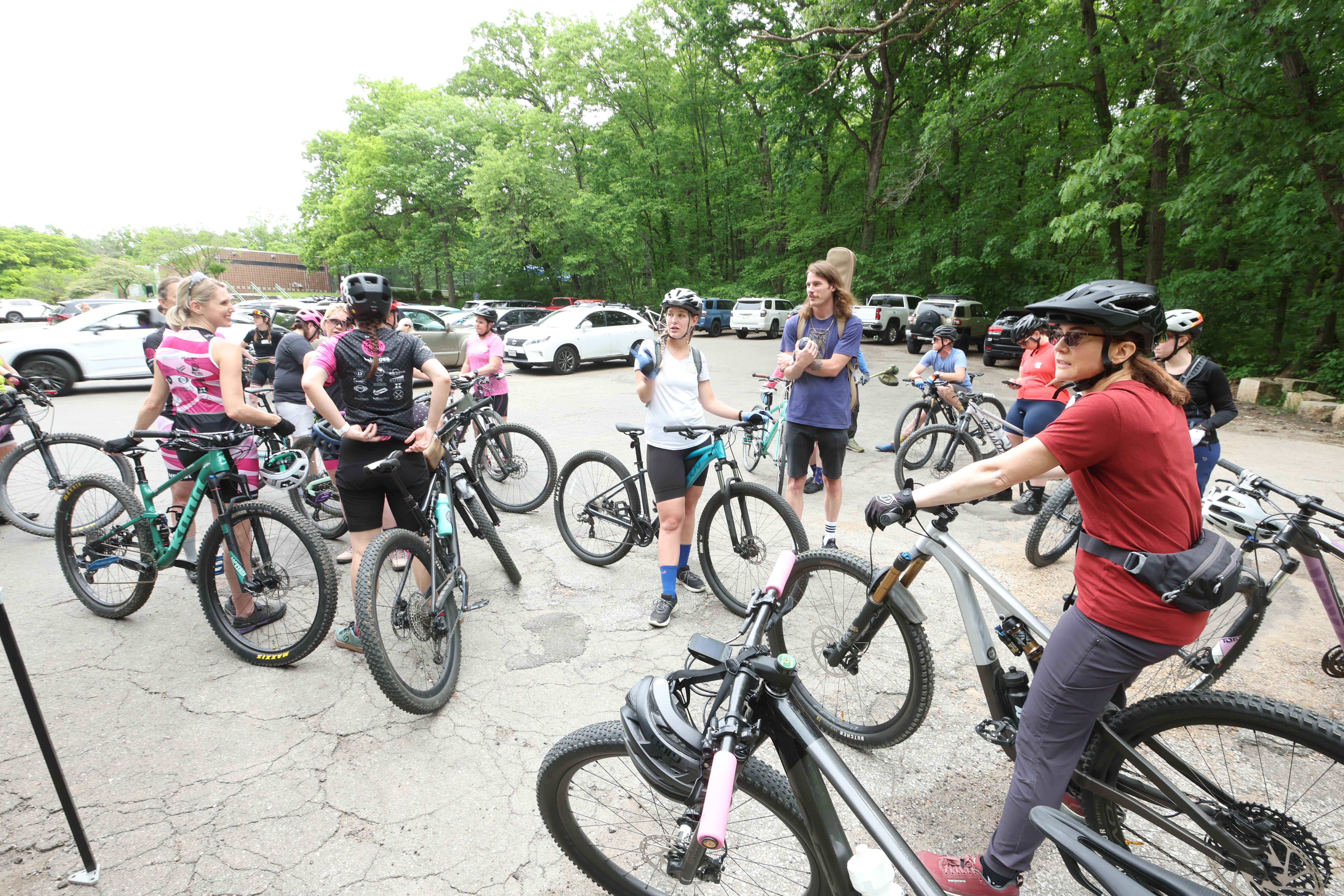 Women cyclists gather at the Ashworth pool parking lot