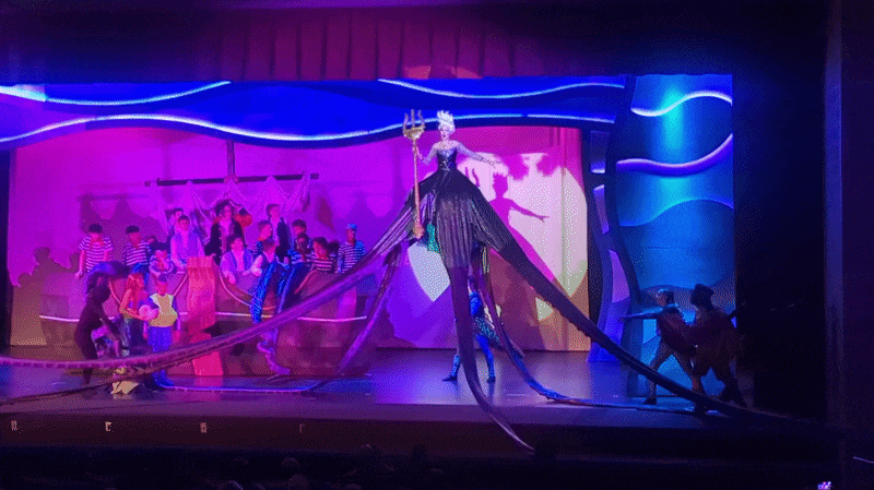 Ursula the sea witch appears as a giant octopus that fills the stage in a live production of The Little Mermaid.