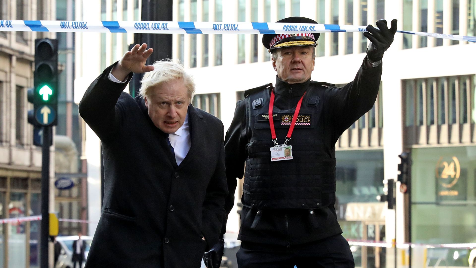 British Prime Minister Boris Johnson, Home Secretary Priti Patel, (L) and City of London commissioner Ian Dyson (R) visit the scene of yesterday's London Bridge stabbing attack on November 30