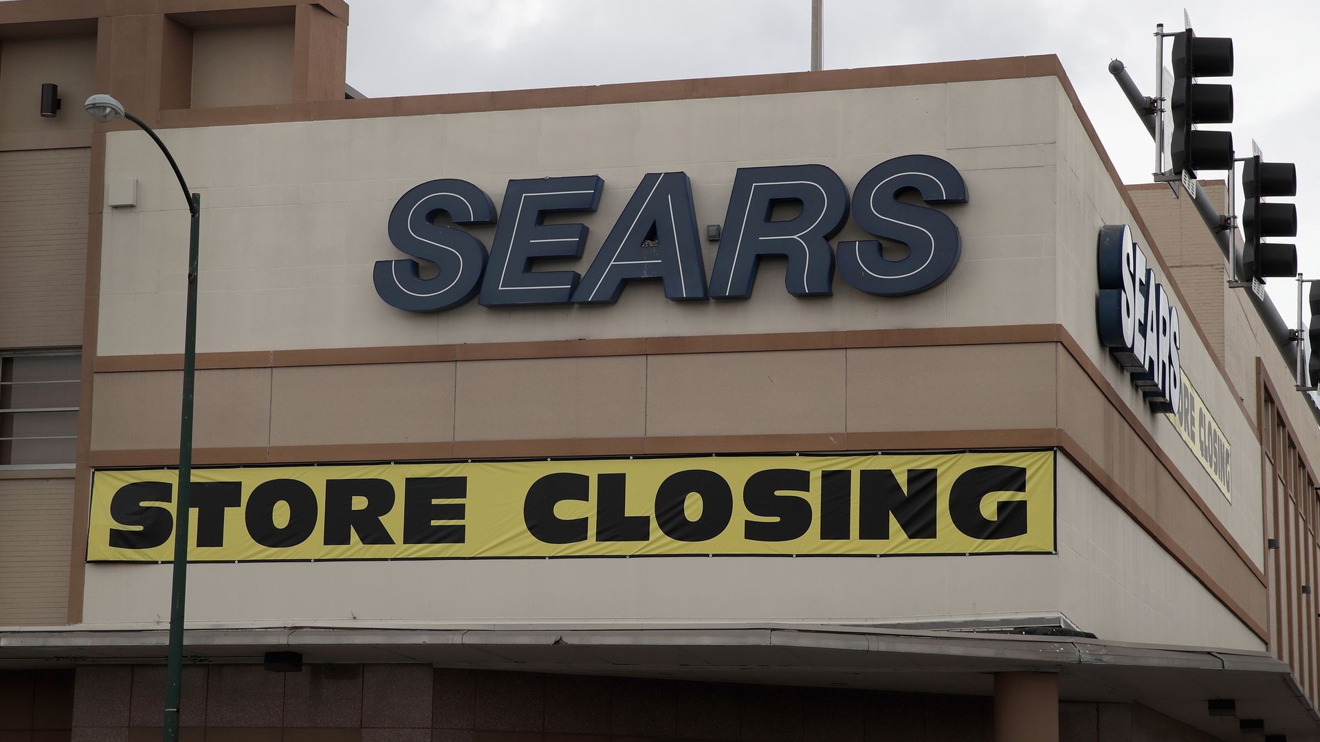 Sears store with a closing sign on it