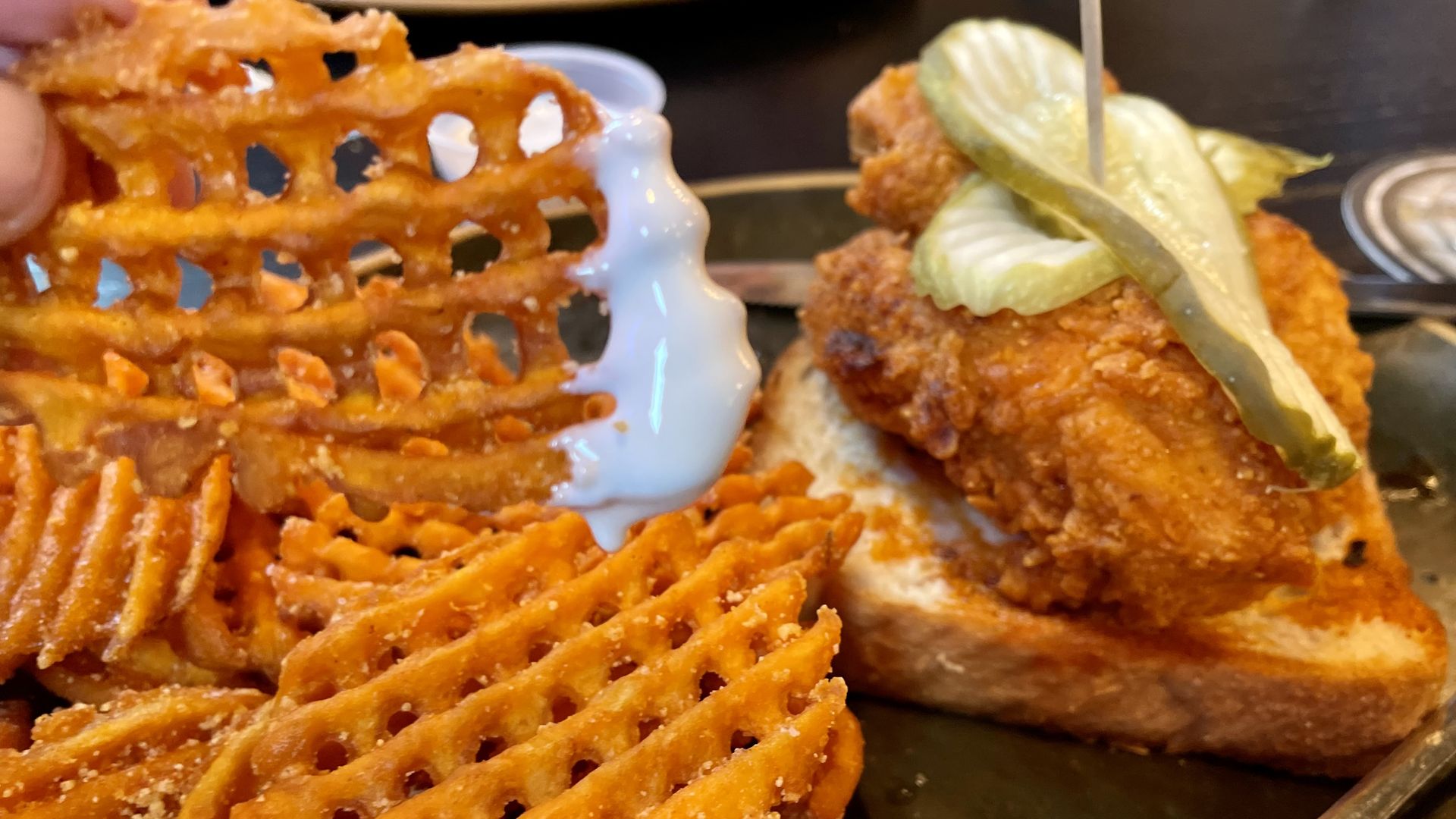 A photo of marshmallow sauce and fries.