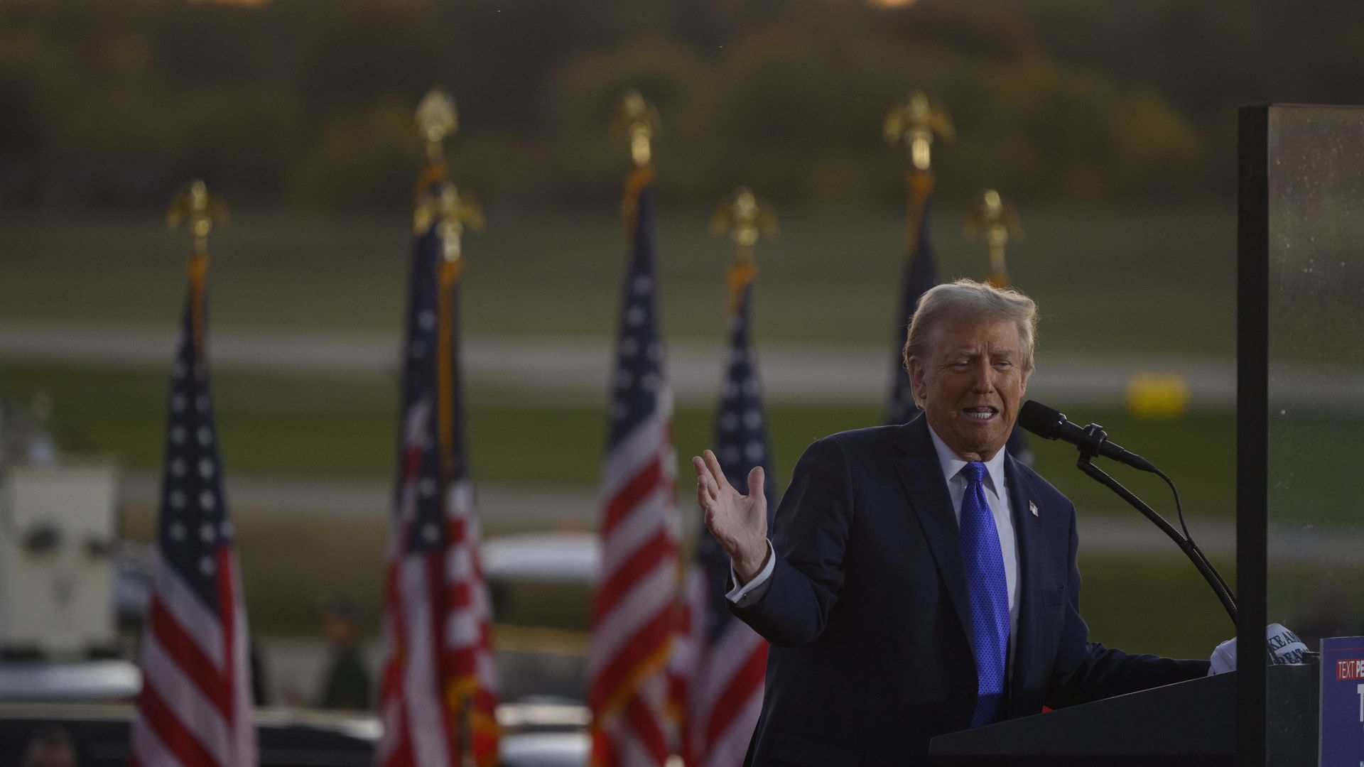  Former President Trump speaks and gestures to supporters at a campaign rally at Arnold Palmer Regional Airport on Oct. 19. 