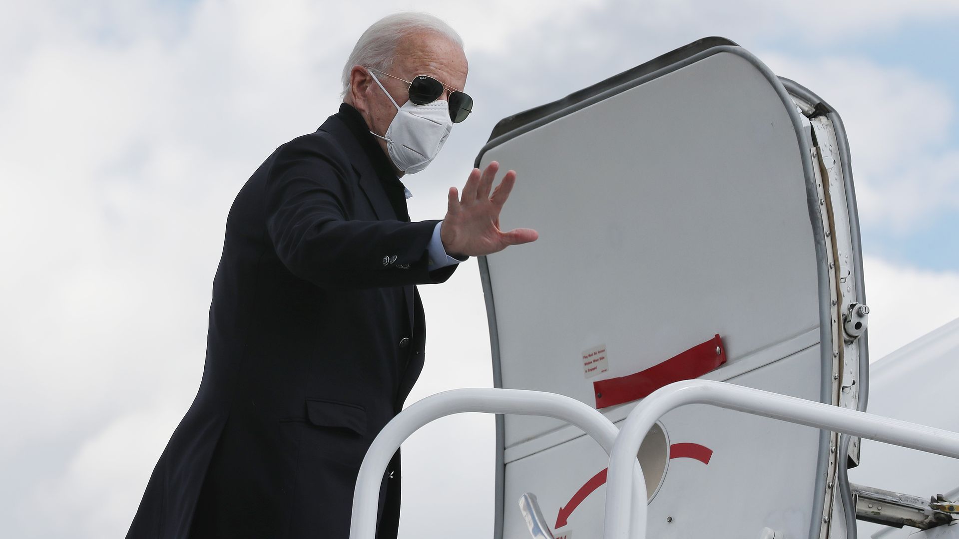 Democratic presidential nominee and former Vice President Joe Biden boards his campaign plane
