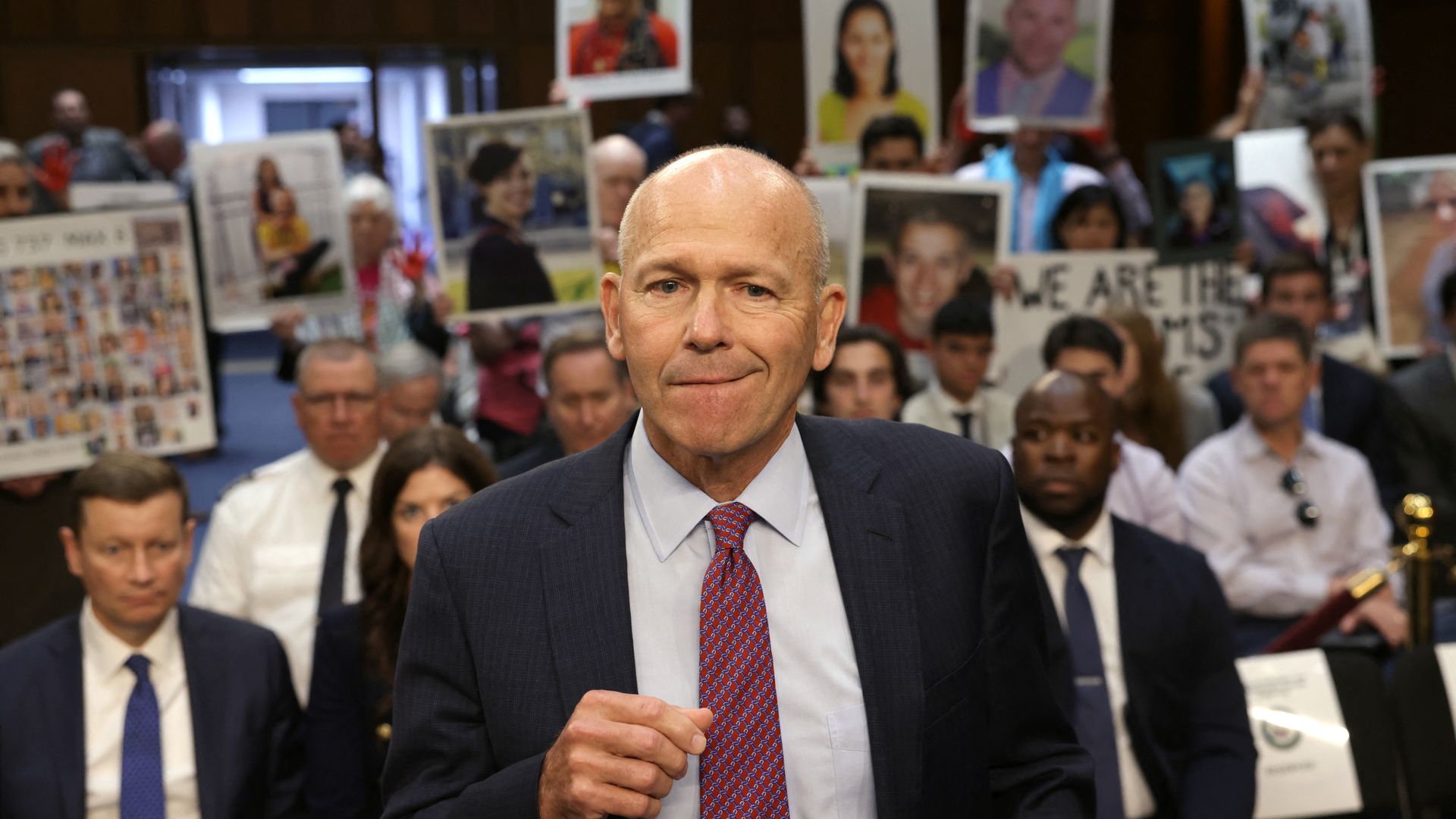 Boeing President and CEO Dave Calhoun in front of relatives of Boeing airplane crash victims in Washington, D.C., on June 18.