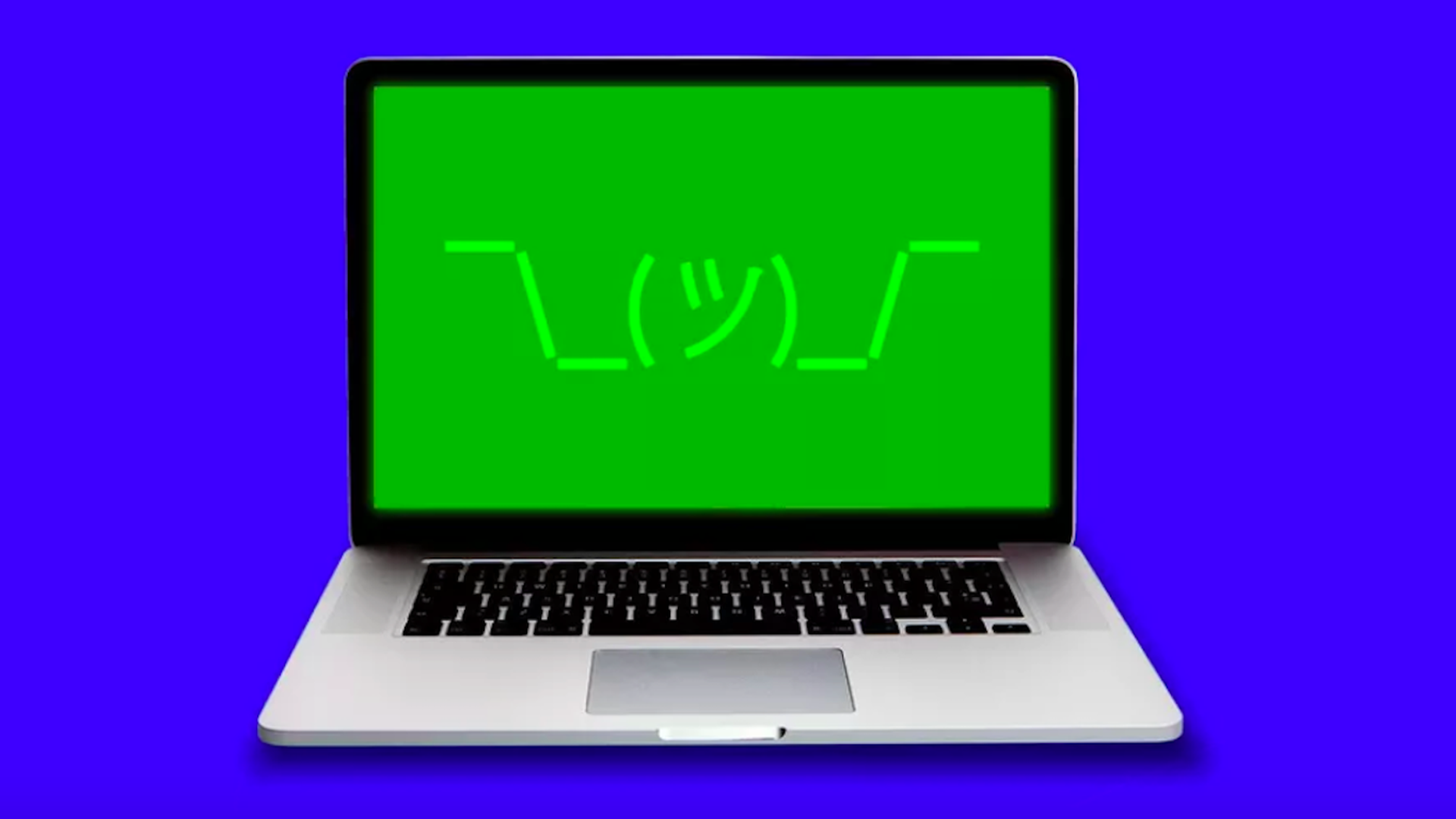 A laptop with a shrugging emoji on the screen