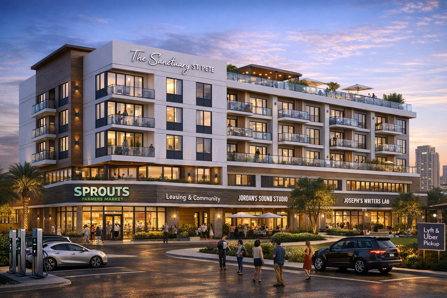 Modern multi-story building "The Sanctuary St. Pete" at dusk with lit storefronts including Sprouts Farmers Market, Jordan's Sound Studio, Joseph's Writers Lab, and people walking in the parking lot.