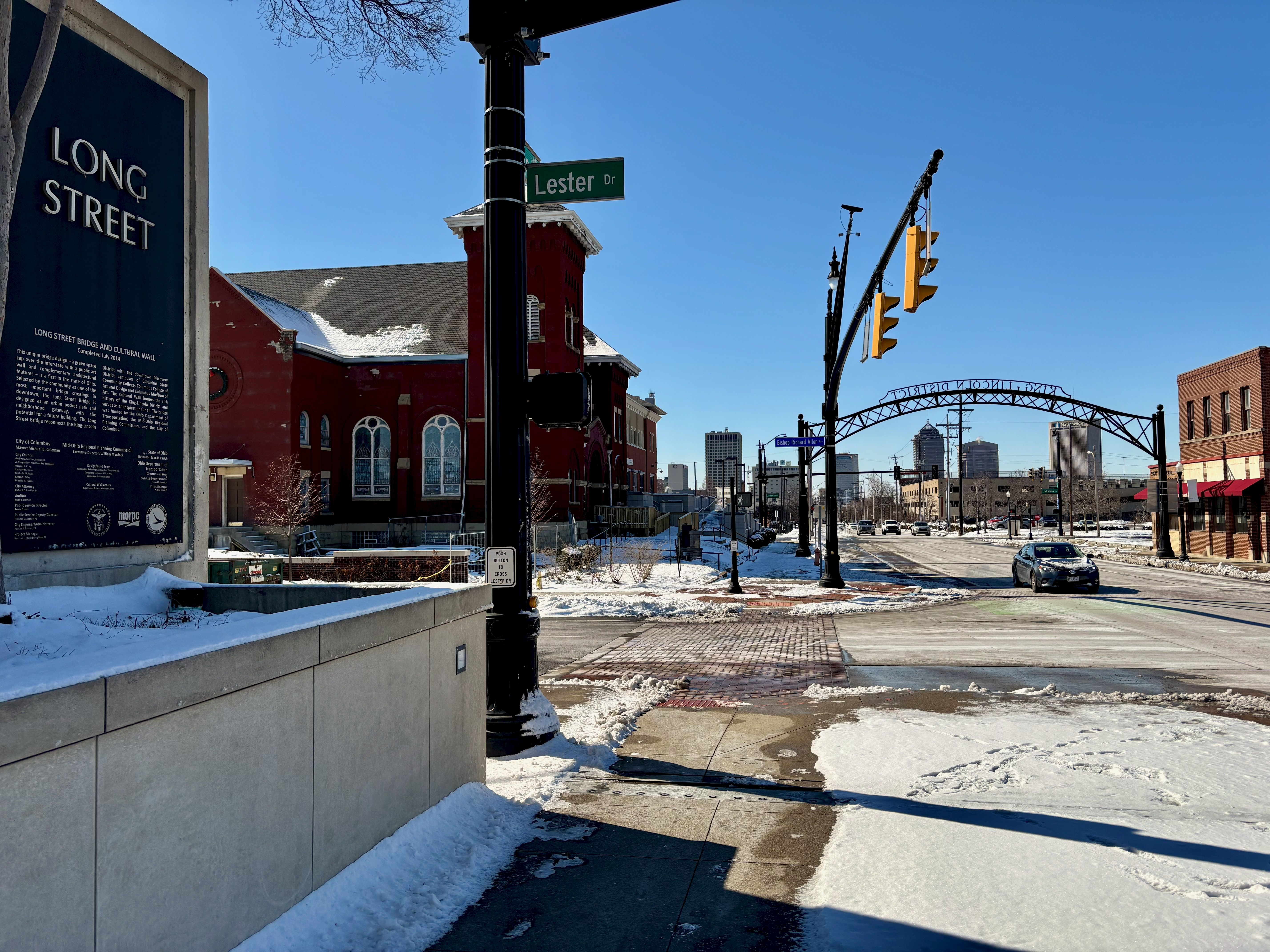 The view of the downtown Columbus skyline from the edge of King-Lincoln Bronzeville, illustrating its close proximity