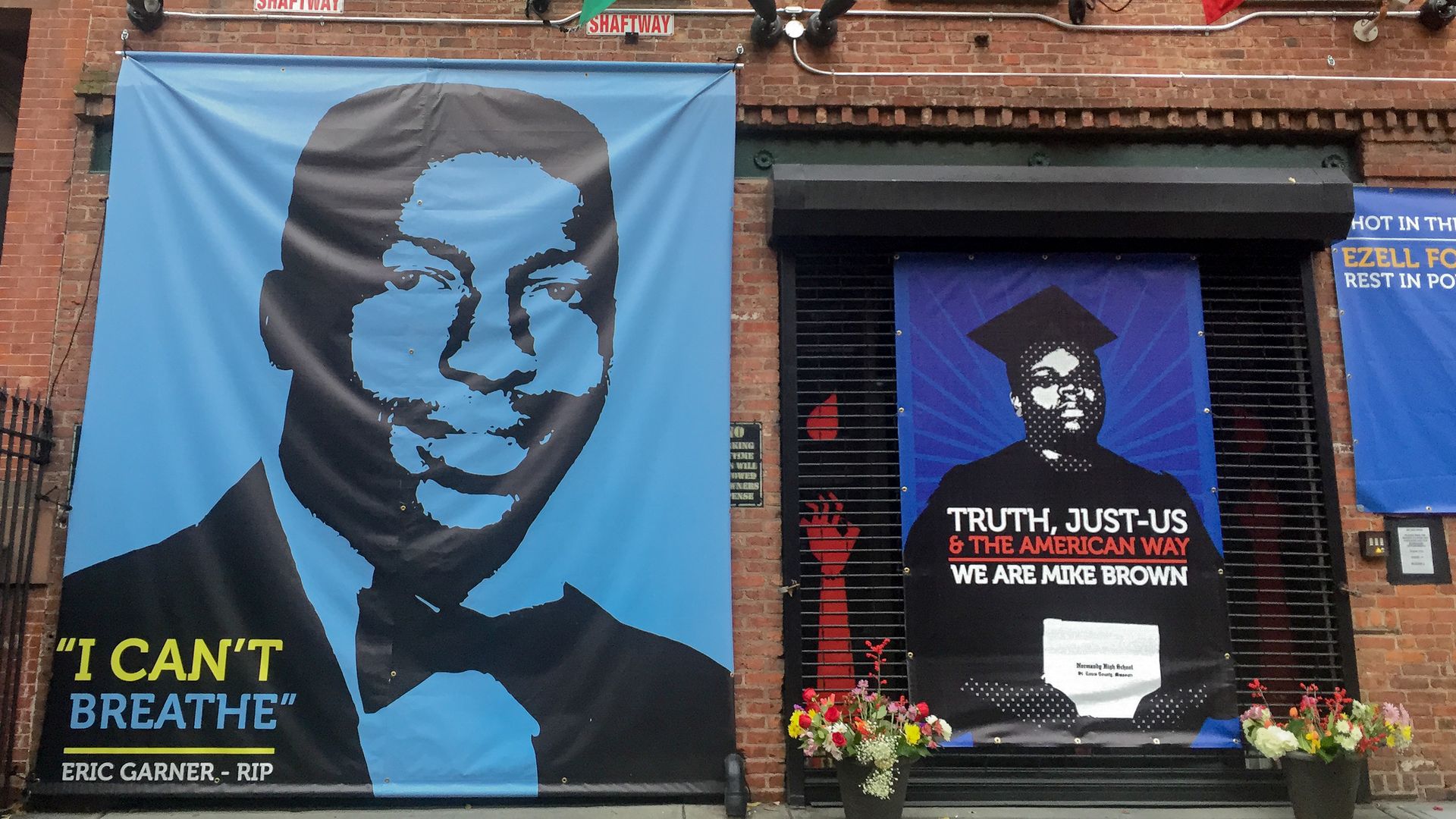 Posters of Eric Garner and Mike Brown who died after interactions with officers