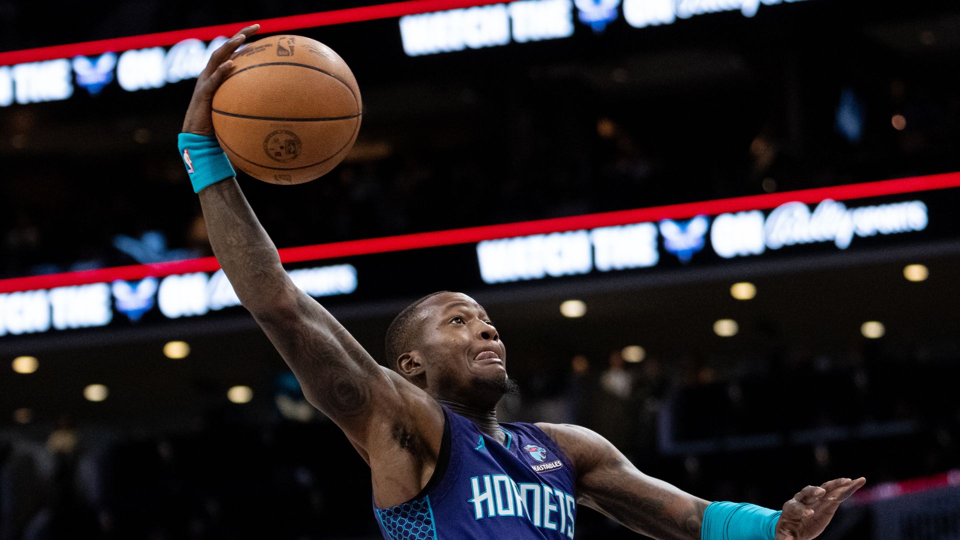 basketball player dunking on a hoop