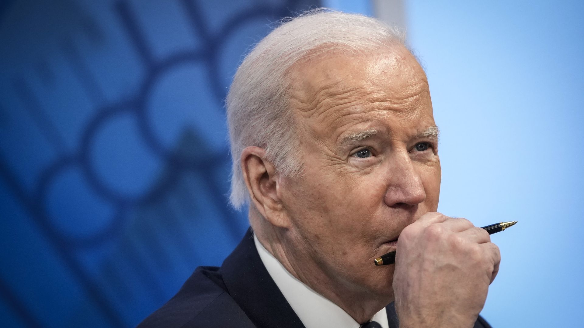 Photo of Joe Biden holding one hand to his chin